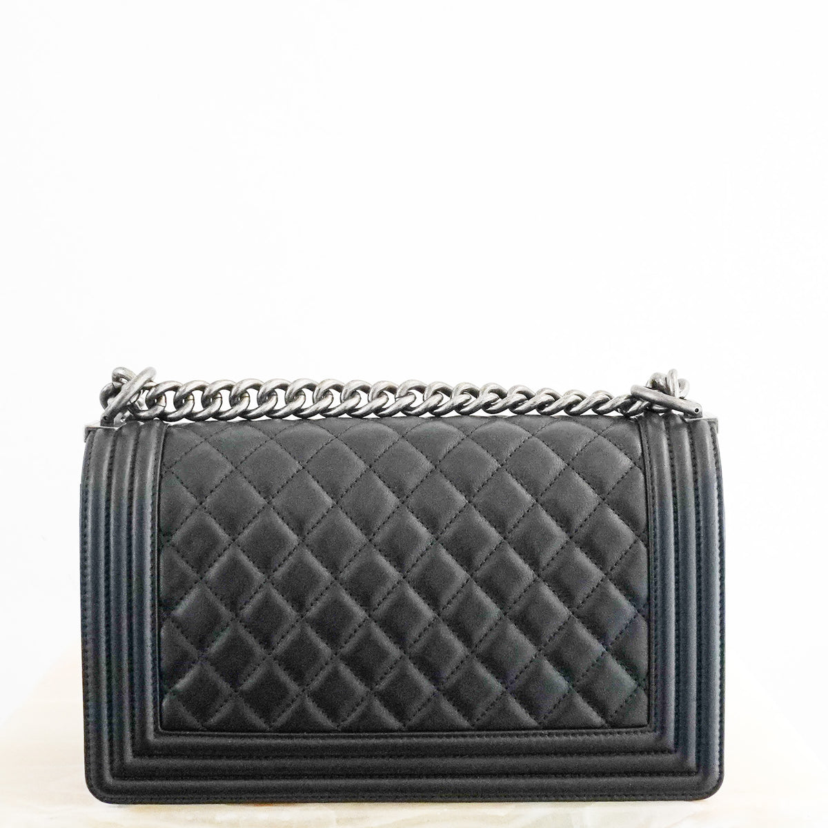 Back: Chanel Medium Boy Bag in Black Quilted Lambskin Leather