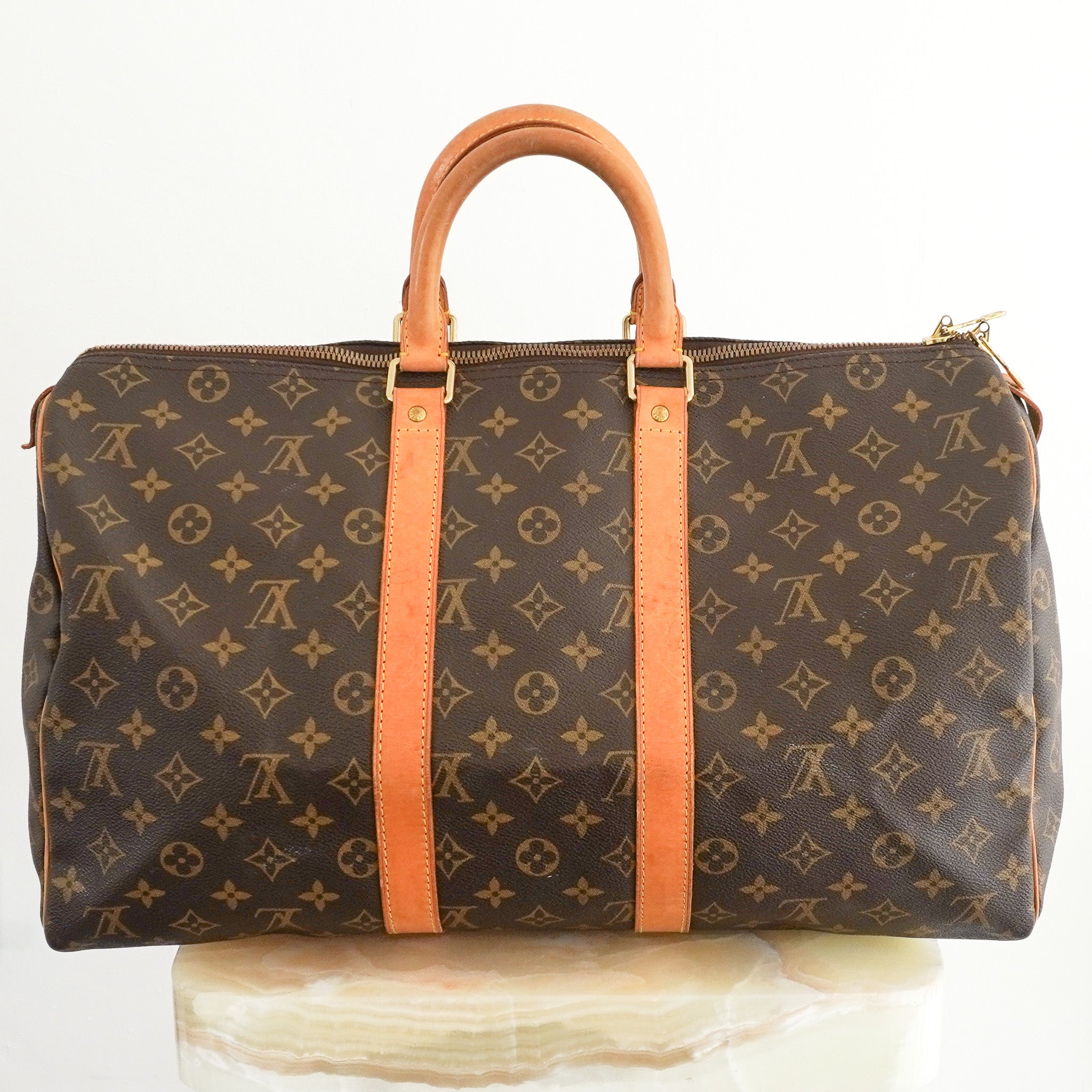 Back image of the Louis Vuitton Keepall Bandoulière 45 in Brown Monogram Canvas with Vachetta Leather