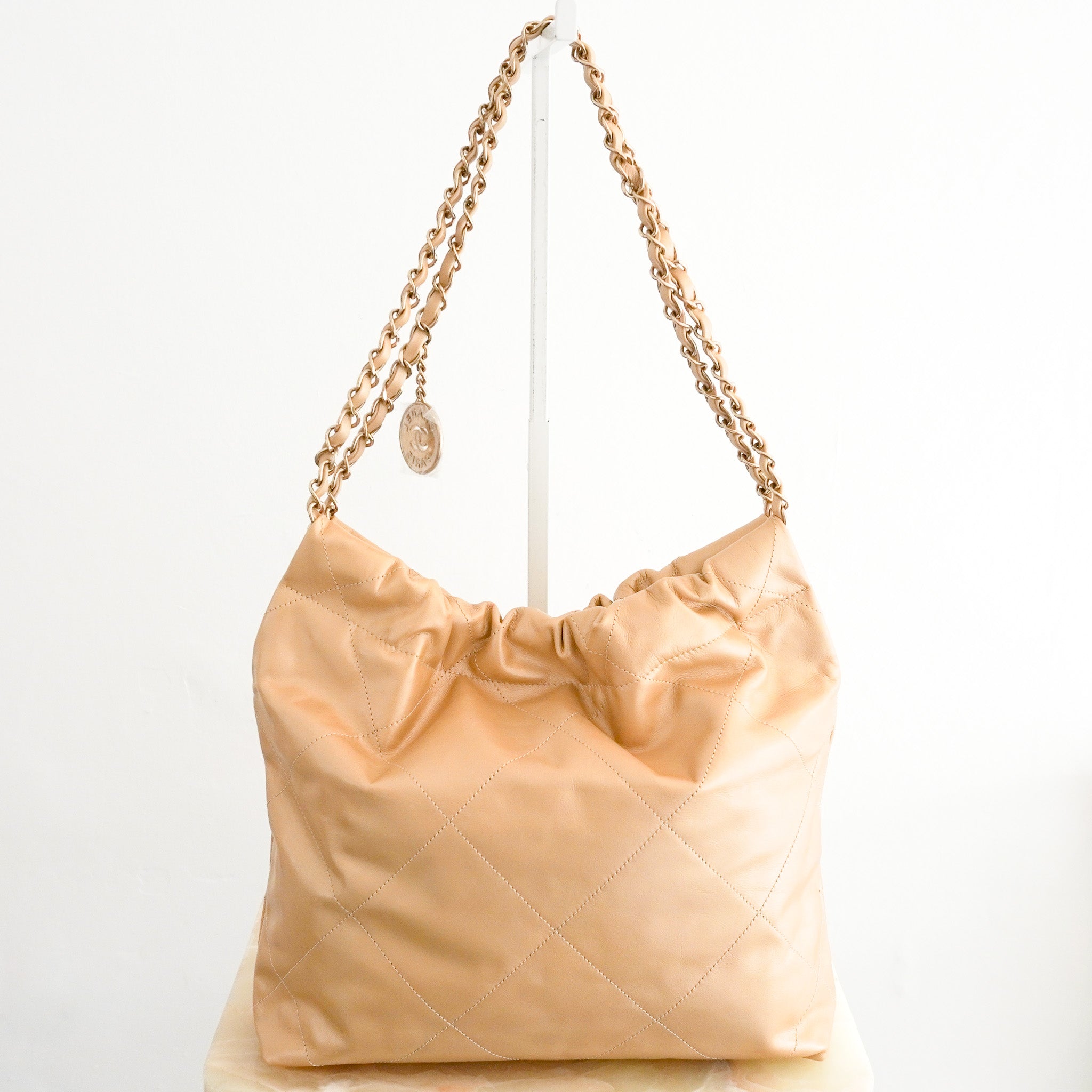 Back image of the NEW Chanel 22 Small Hobo Bag in Gold Shiny Calfskin