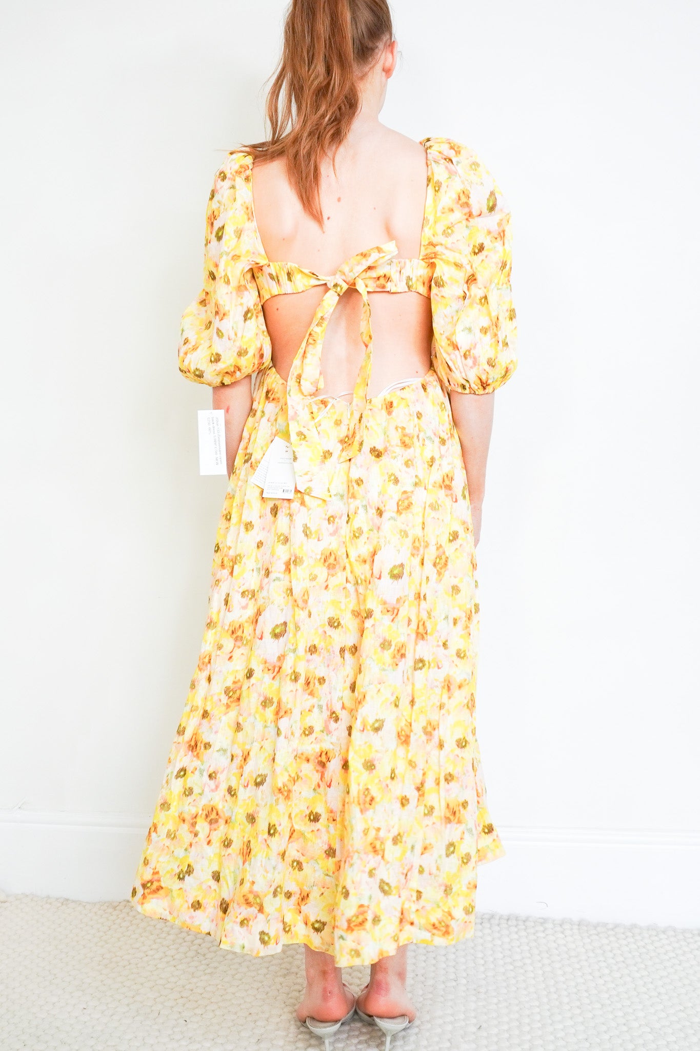 Back image of the Zimmermann Open Back Yellow Dress