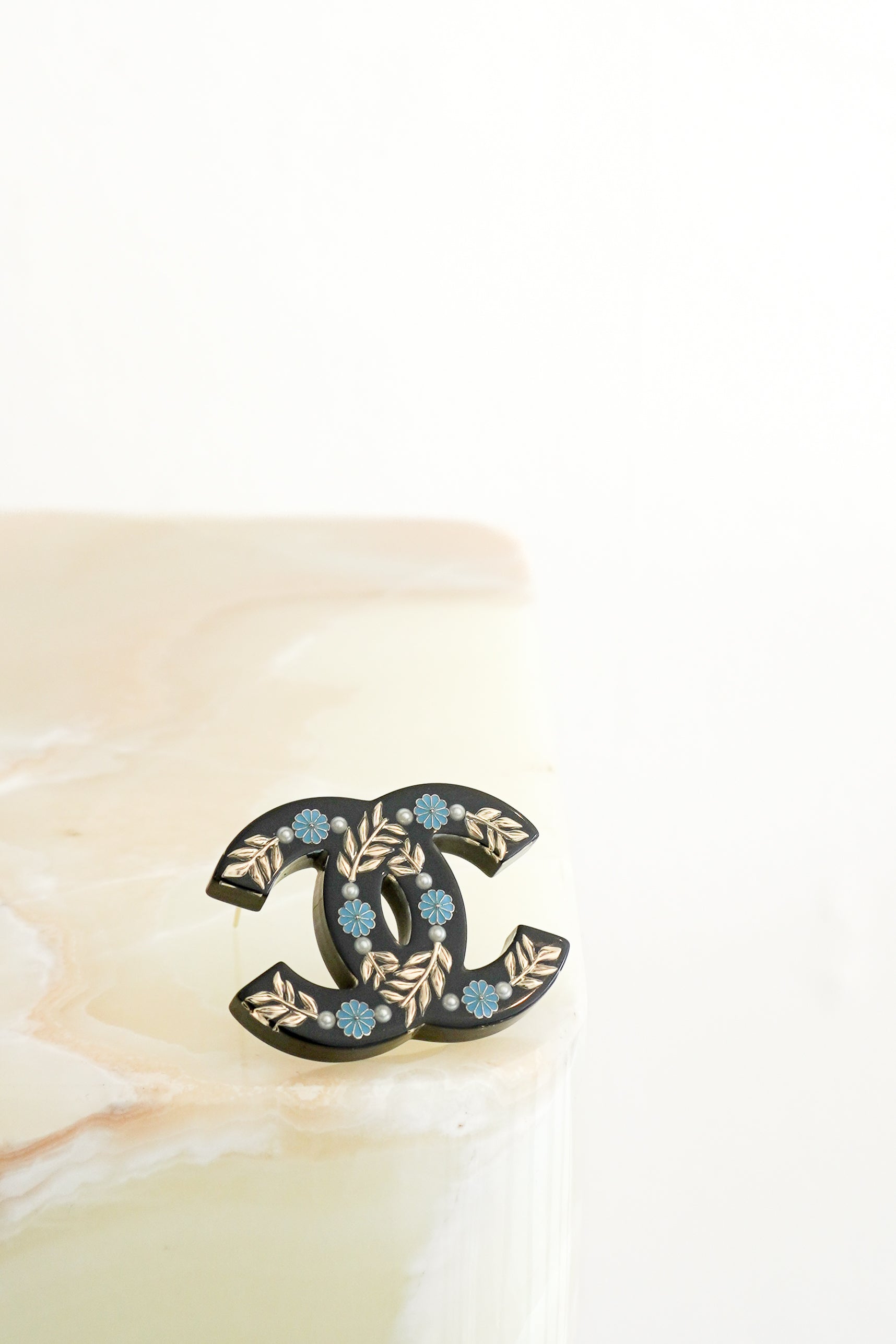 Chanel 18C Floral CC Logo Brooch in Black Resin front photo chelsea london