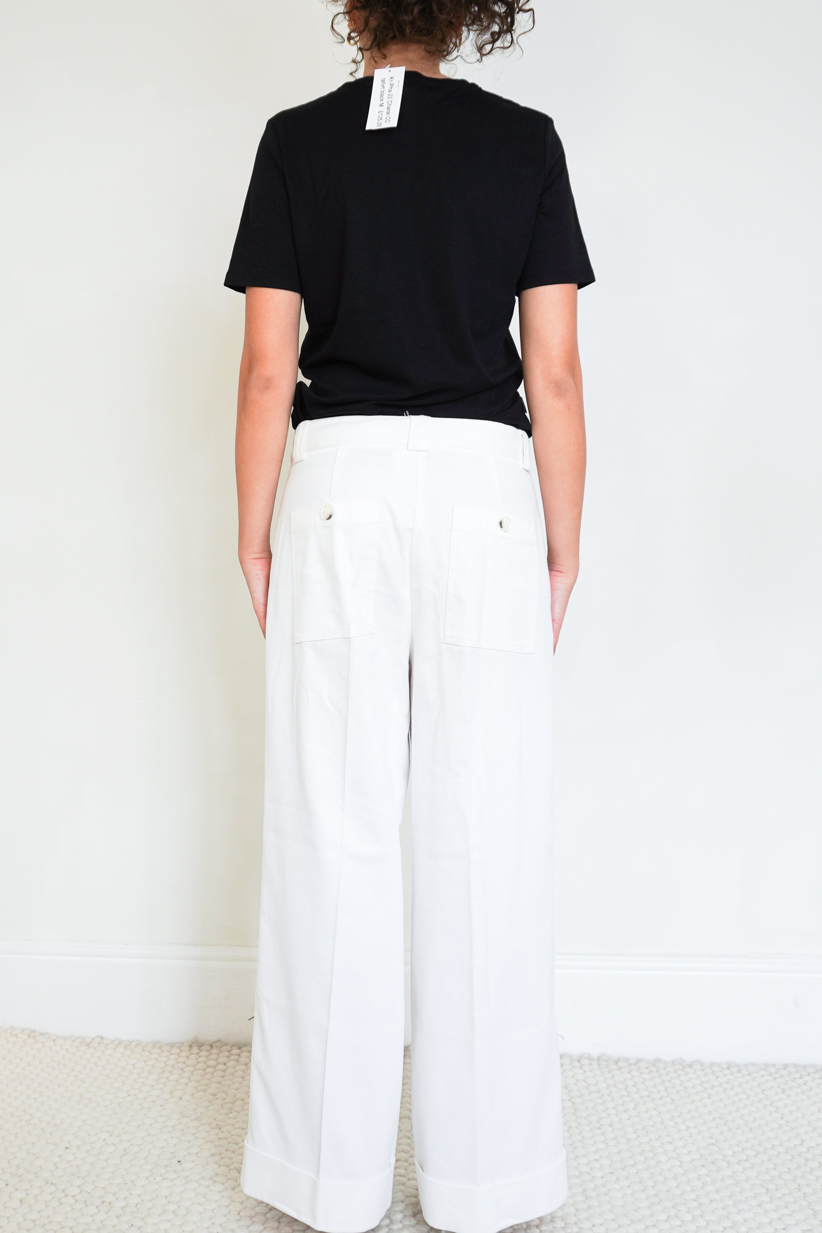 side photo of a Chanel Black CC Logo Uniform T-Shirt