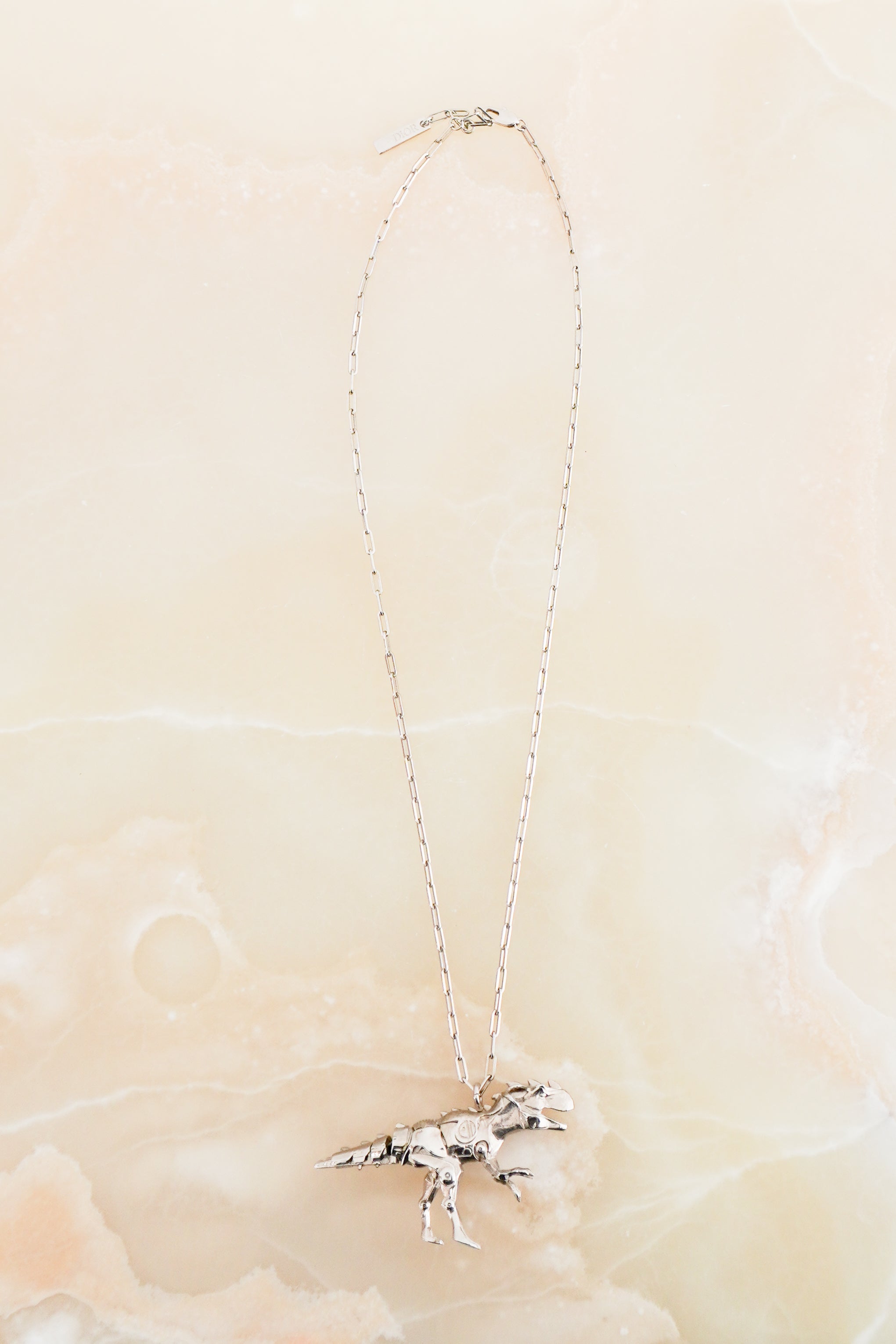 Christian Dior x Hajime Sorayama Robot Dinosaur Brass Necklace in Silver front photo chelsea london