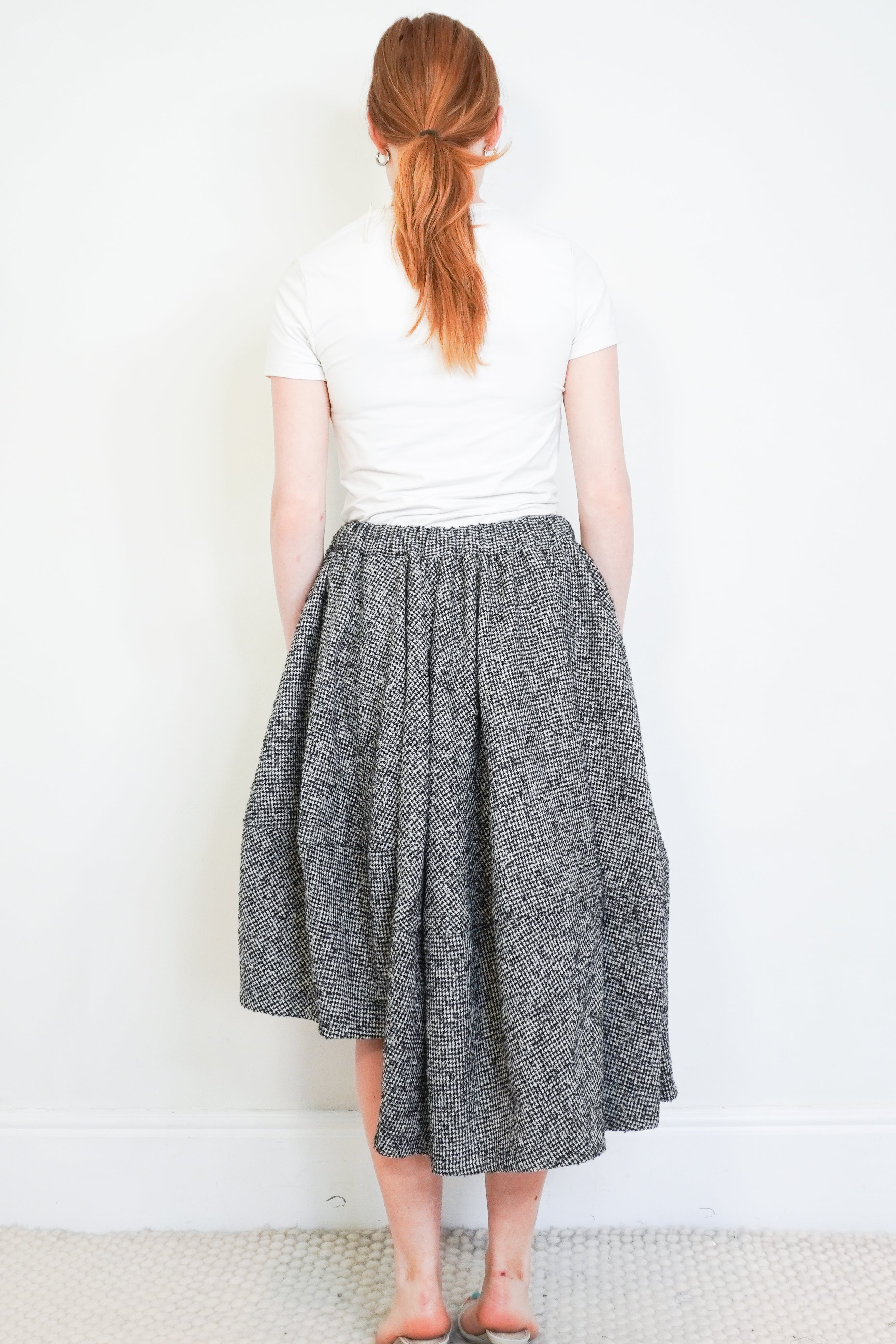 Commes de Garçons Black & Ecru Pinwheel Houndstooth Asymmetric Wool Skirt back photo chelsea london