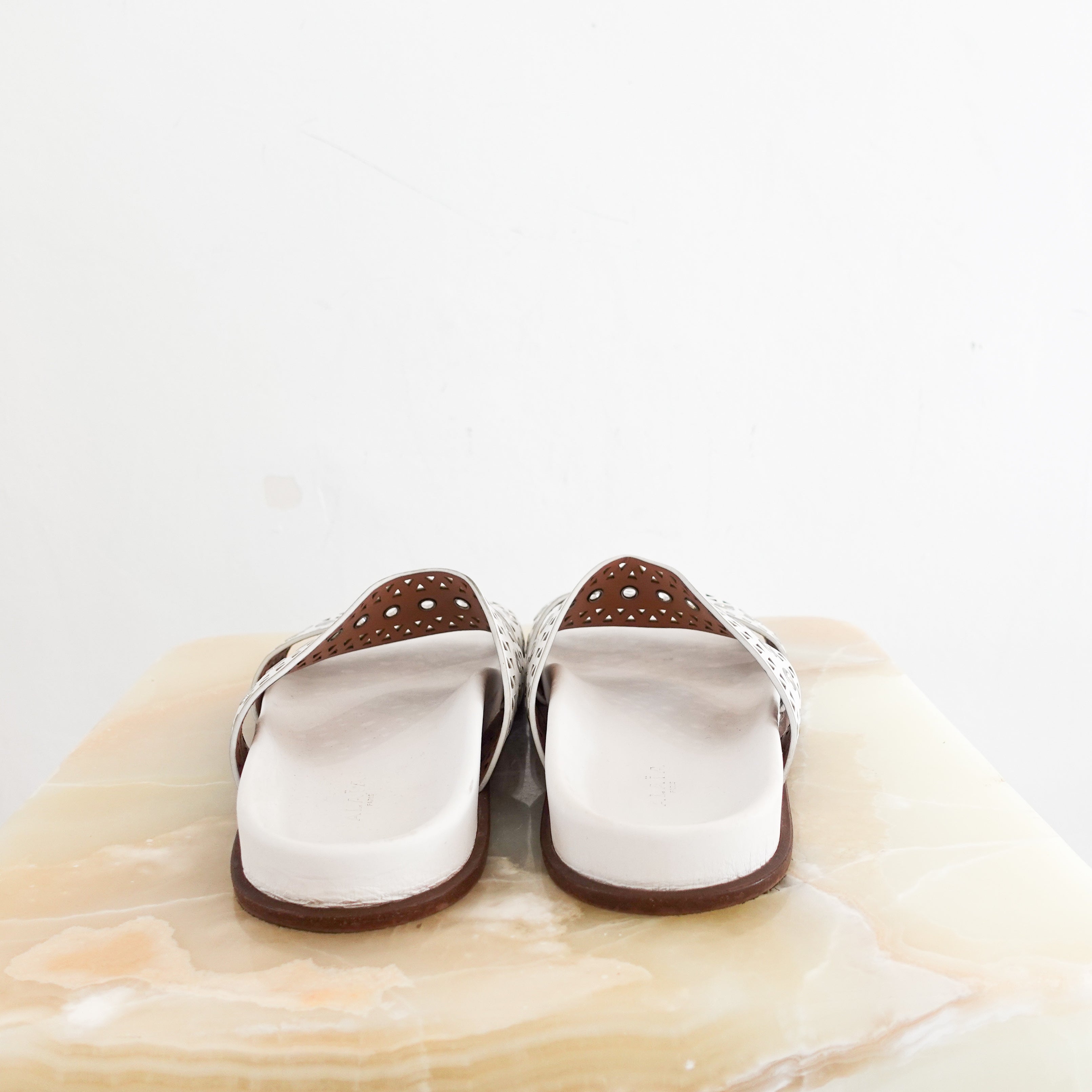 Alaia Perforated Sliders in white RRP £750 | Authentic Preloved