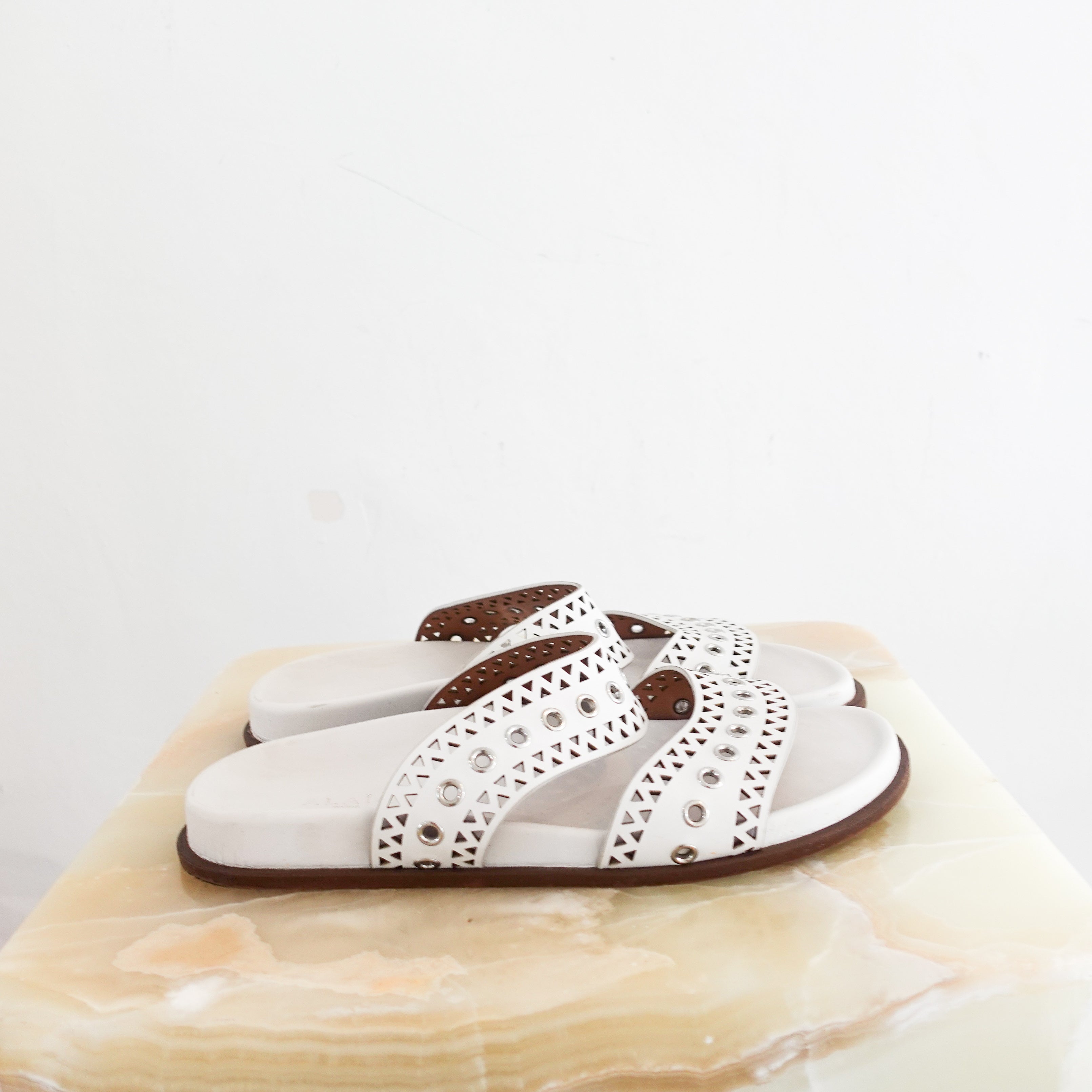 Alaia Perforated Sliders in white RRP £750 | Authentic Preloved