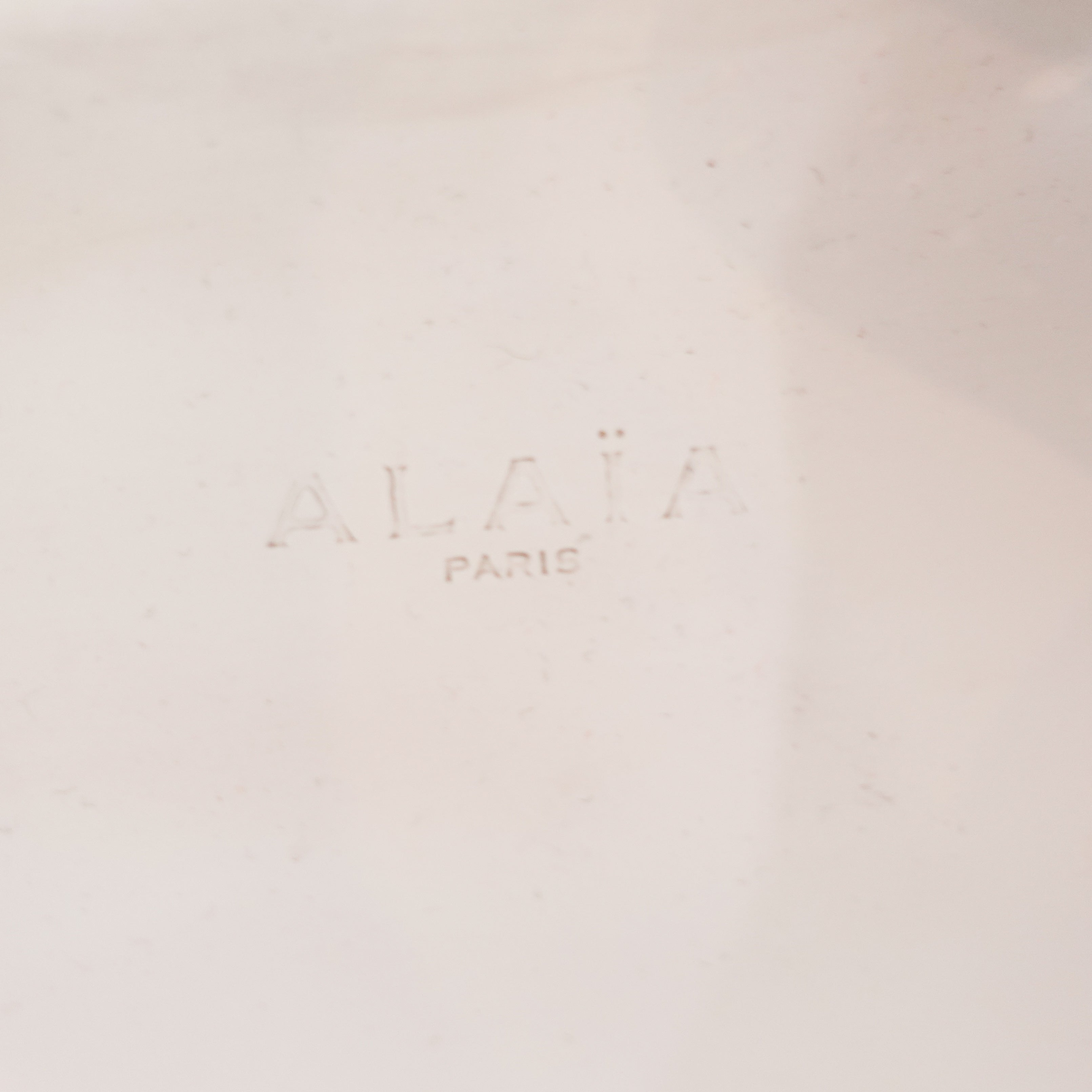 Alaia Perforated Sliders in white RRP £750 | Authentic Preloved