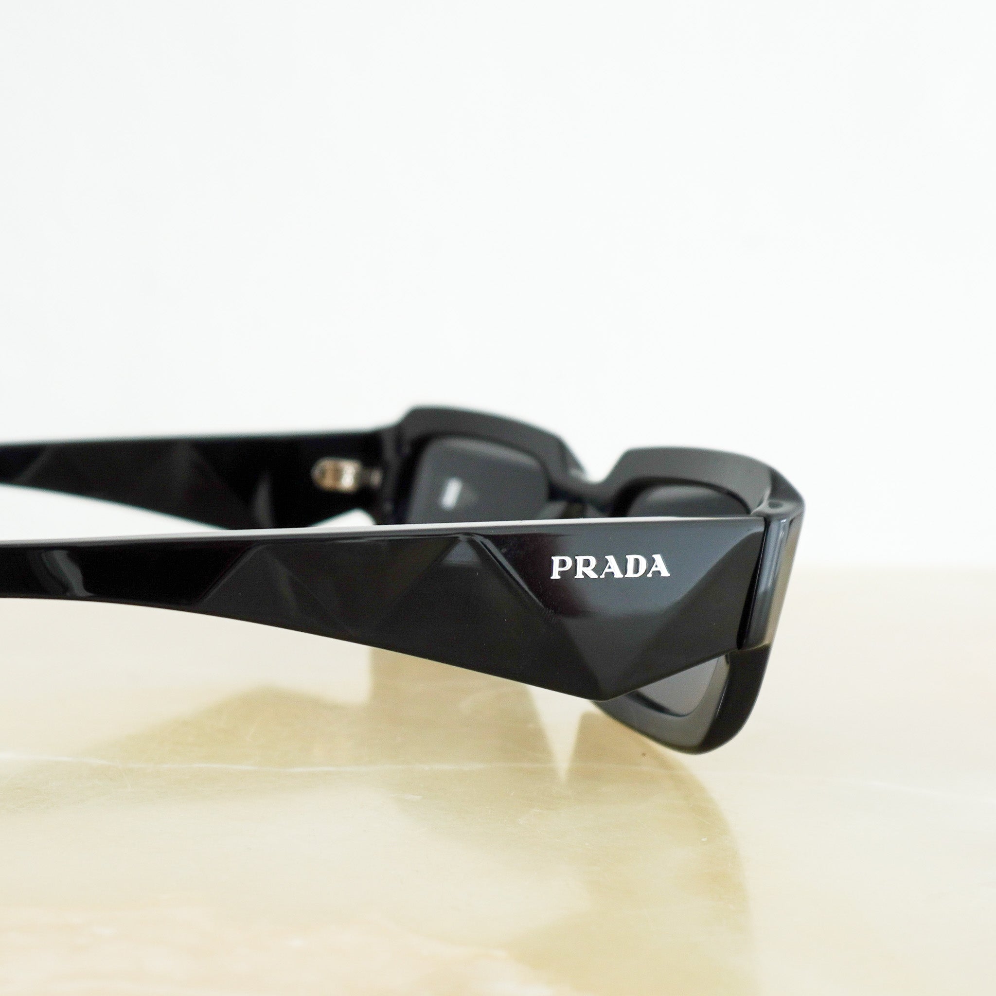 Prada Symbole Sunglasses in Black (RRP £310) | Authentic Preloved - Reloved Again