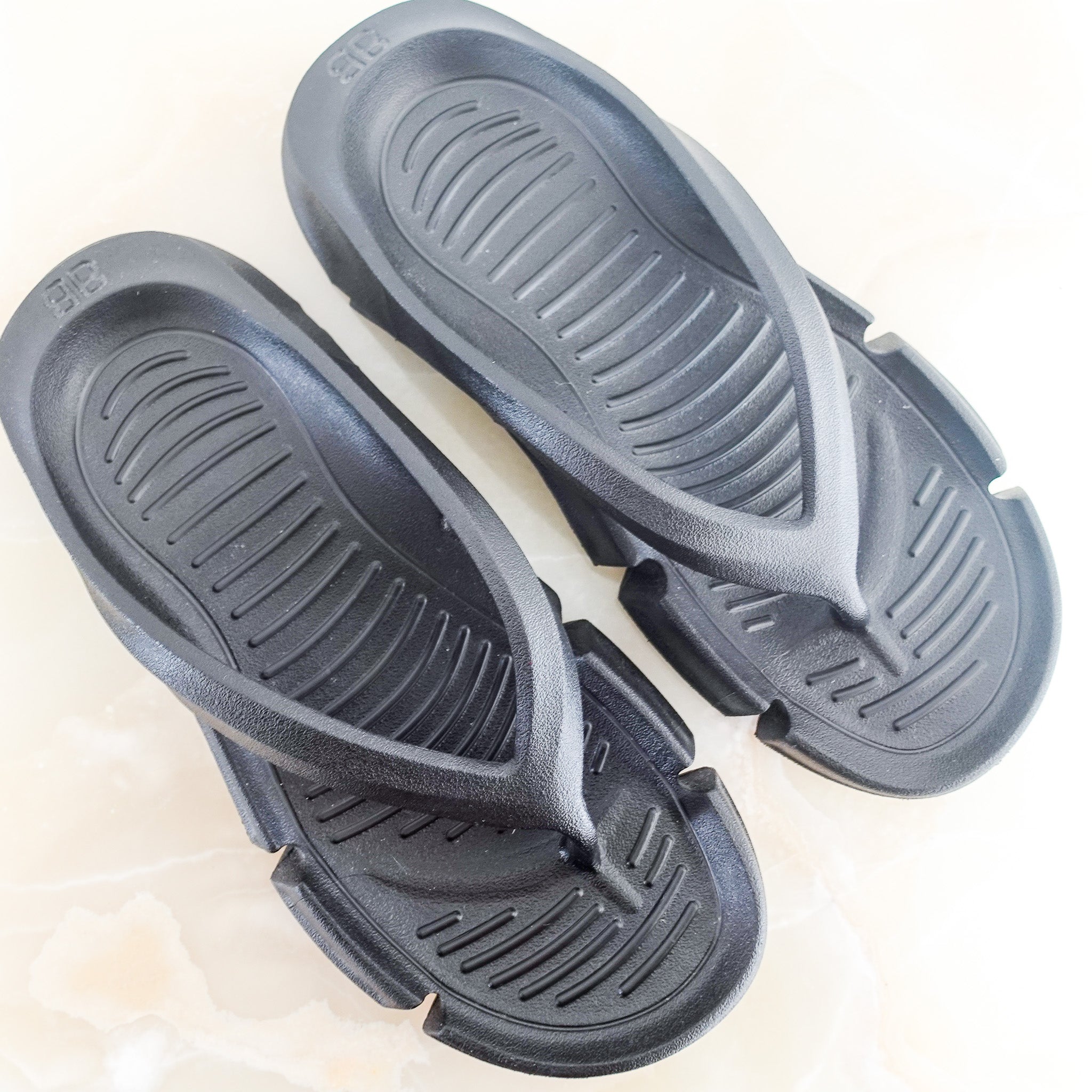 Black flip flops RRP £330