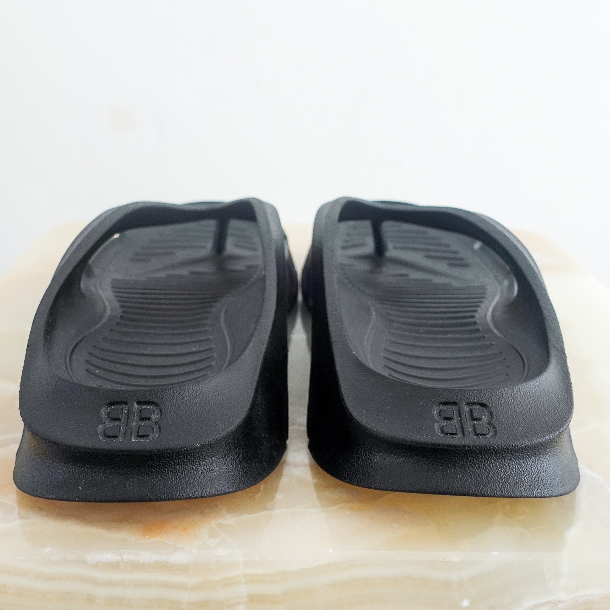 Black flip flops RRP £330