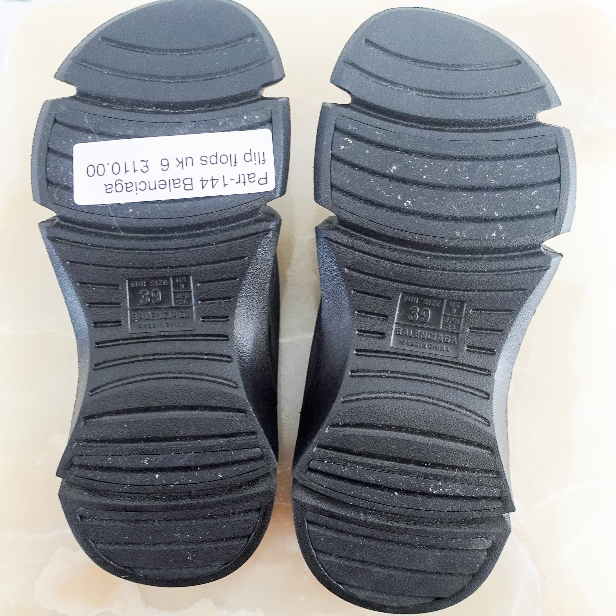 Black flip flops RRP £330