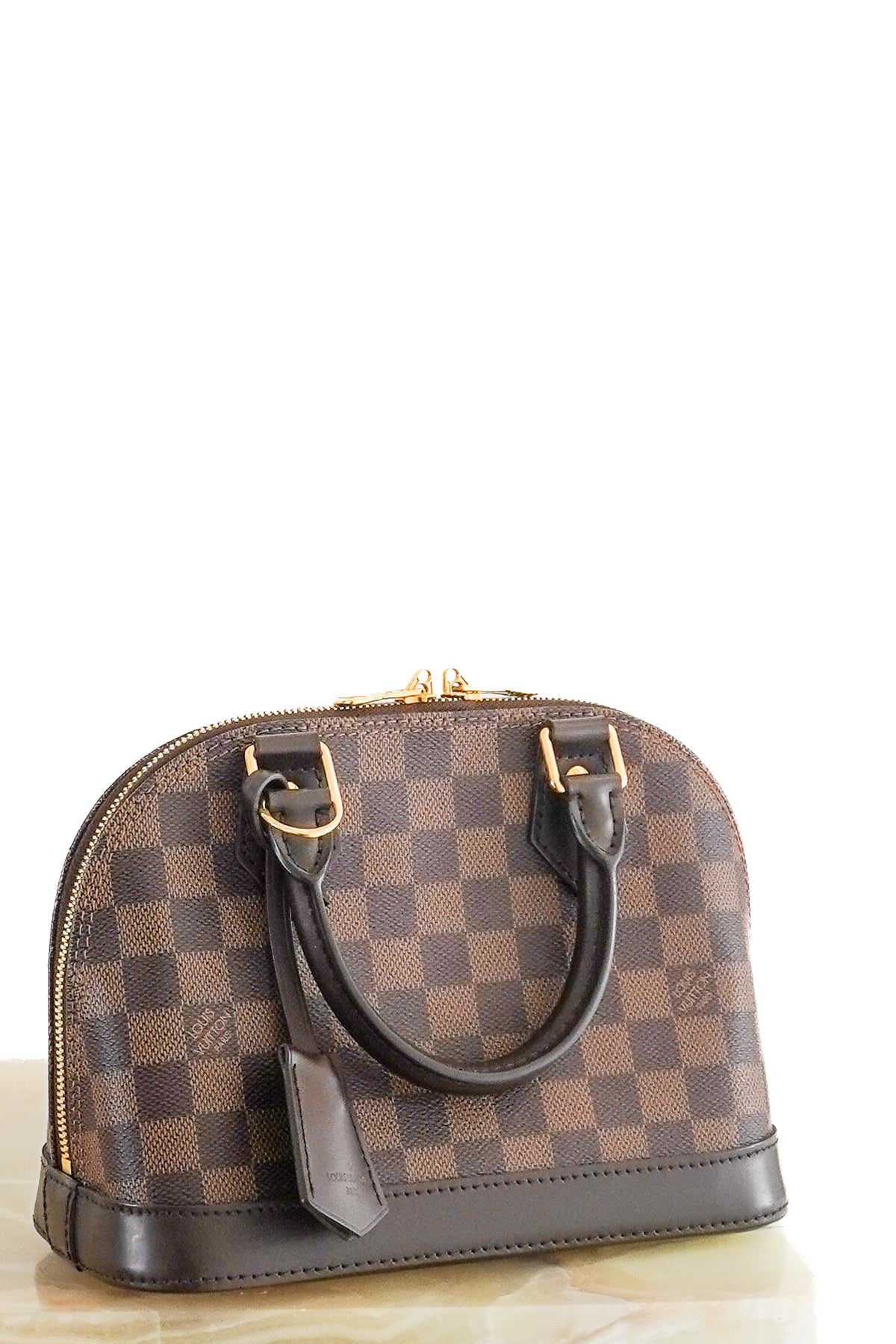 Front: Louis Vuitton Alma BB Bag in Damier Ebene Canvas