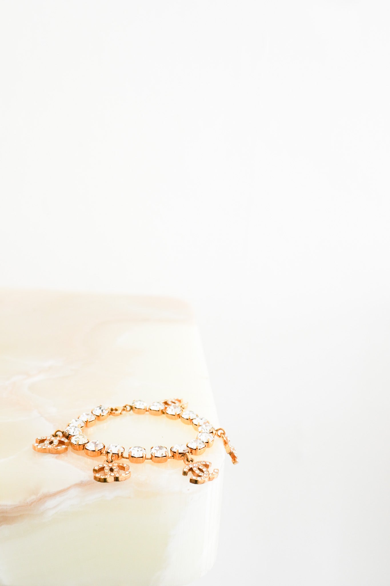 Front Photograph of the Chanel 1996 24K Gold Plated Crystal CC Chain Bracelet | Authentic Preloved - Reloved Again Chelsea London