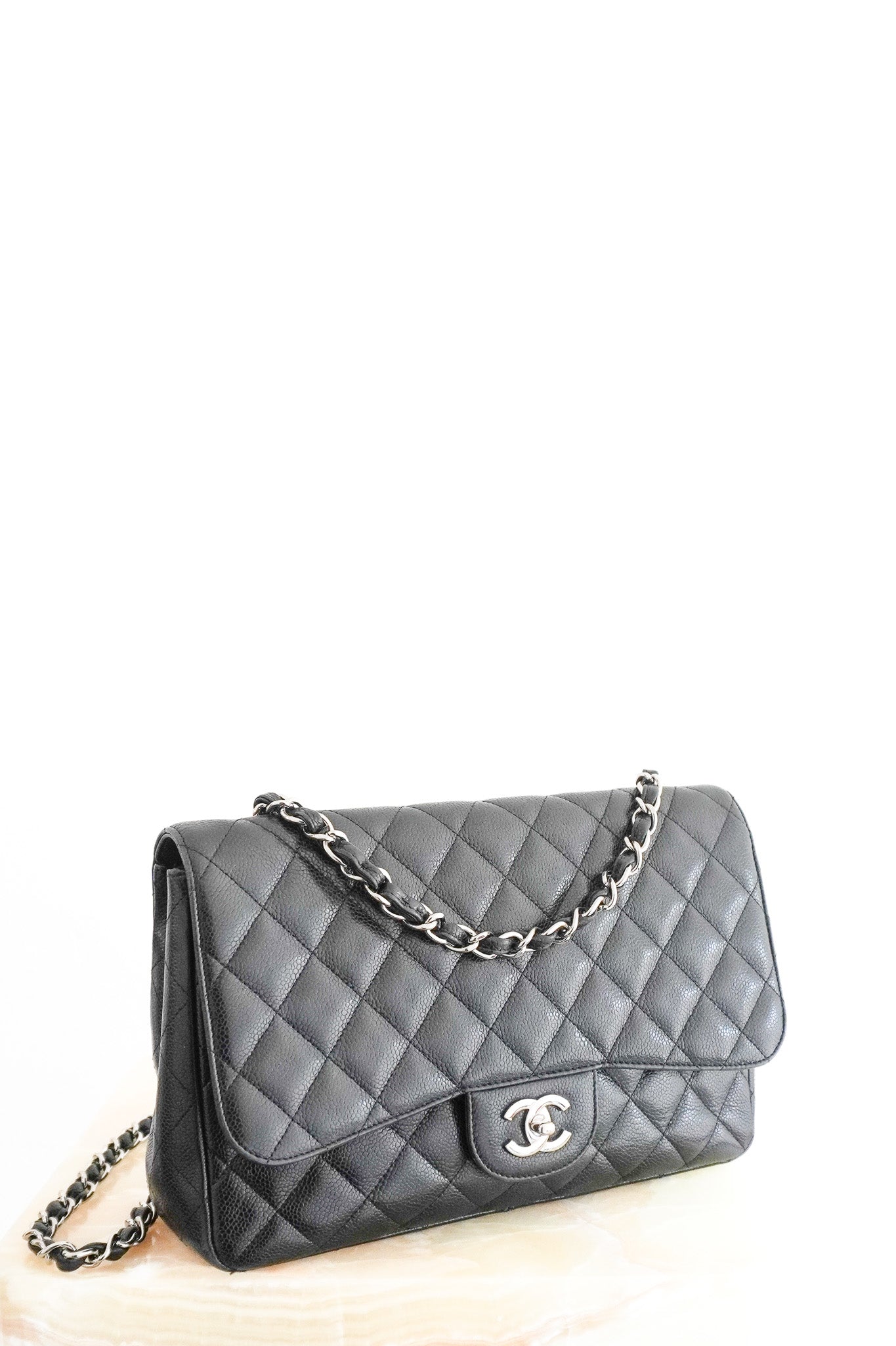 Front image of the Chanel Jumbo Classic Single Flap Bag in Black Caviar Leather Chelsea London