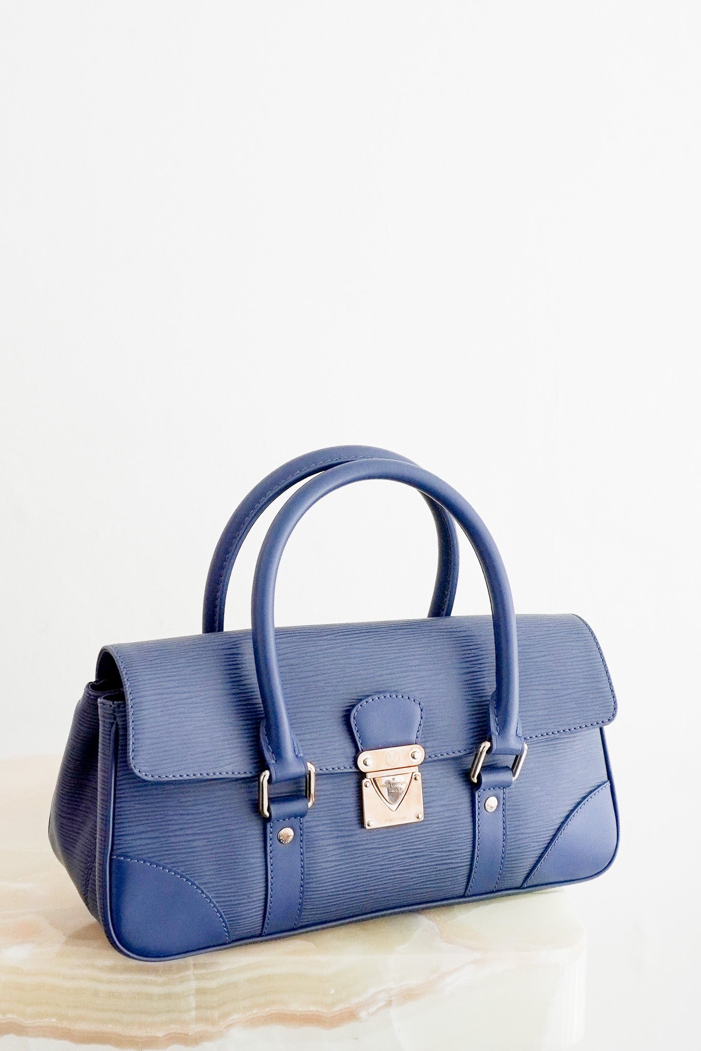 Front image of the Louis Vuitton Ségur PM Toledo Blue Epi Leather Handbag Chelsea
london