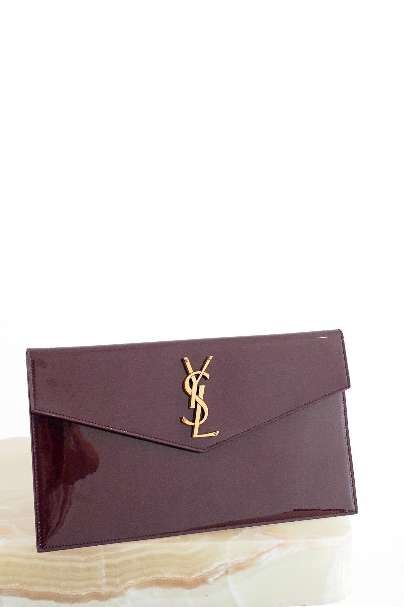 Front image of the Saint Laurent Uptown Pouch in Dark Red Patent Leather Chelsea London