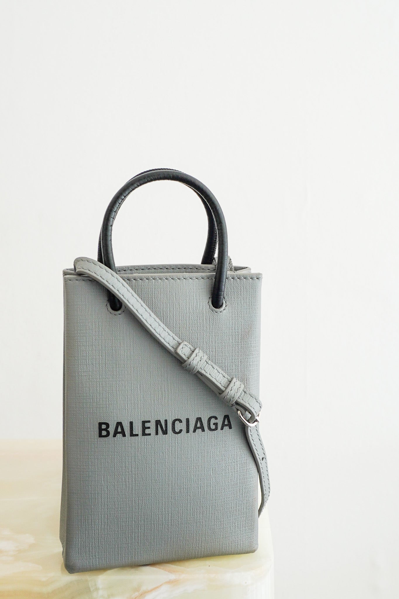 Front photo of the Balenciaga Shopping Phone Holder Bag Chelsea London