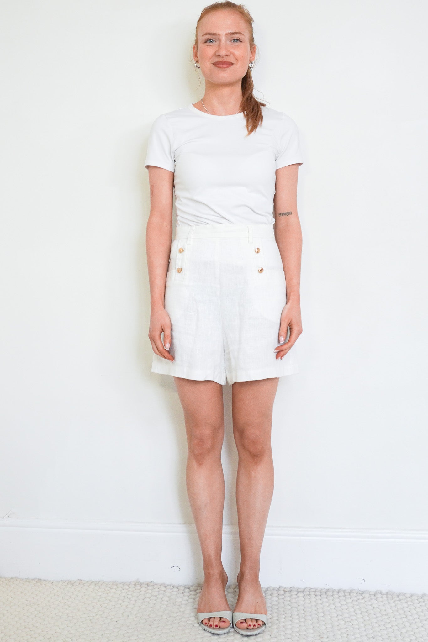 Front photo of the Miguelina White Linen Shorts chelsea London