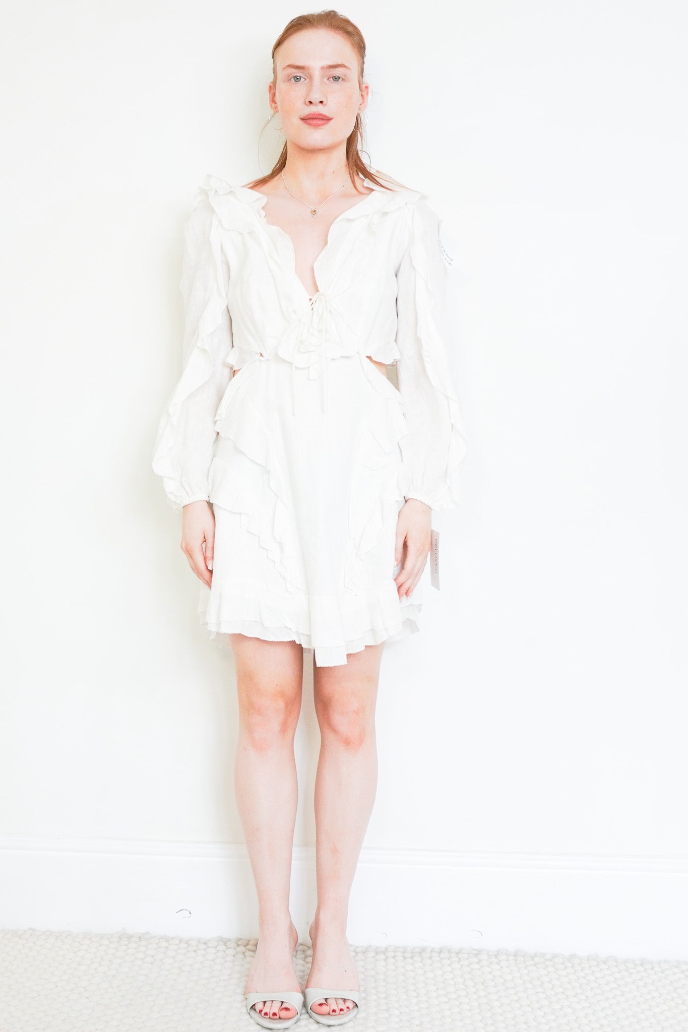 Front photo of the Zimmermann Cream Mini Dress Chelsea London