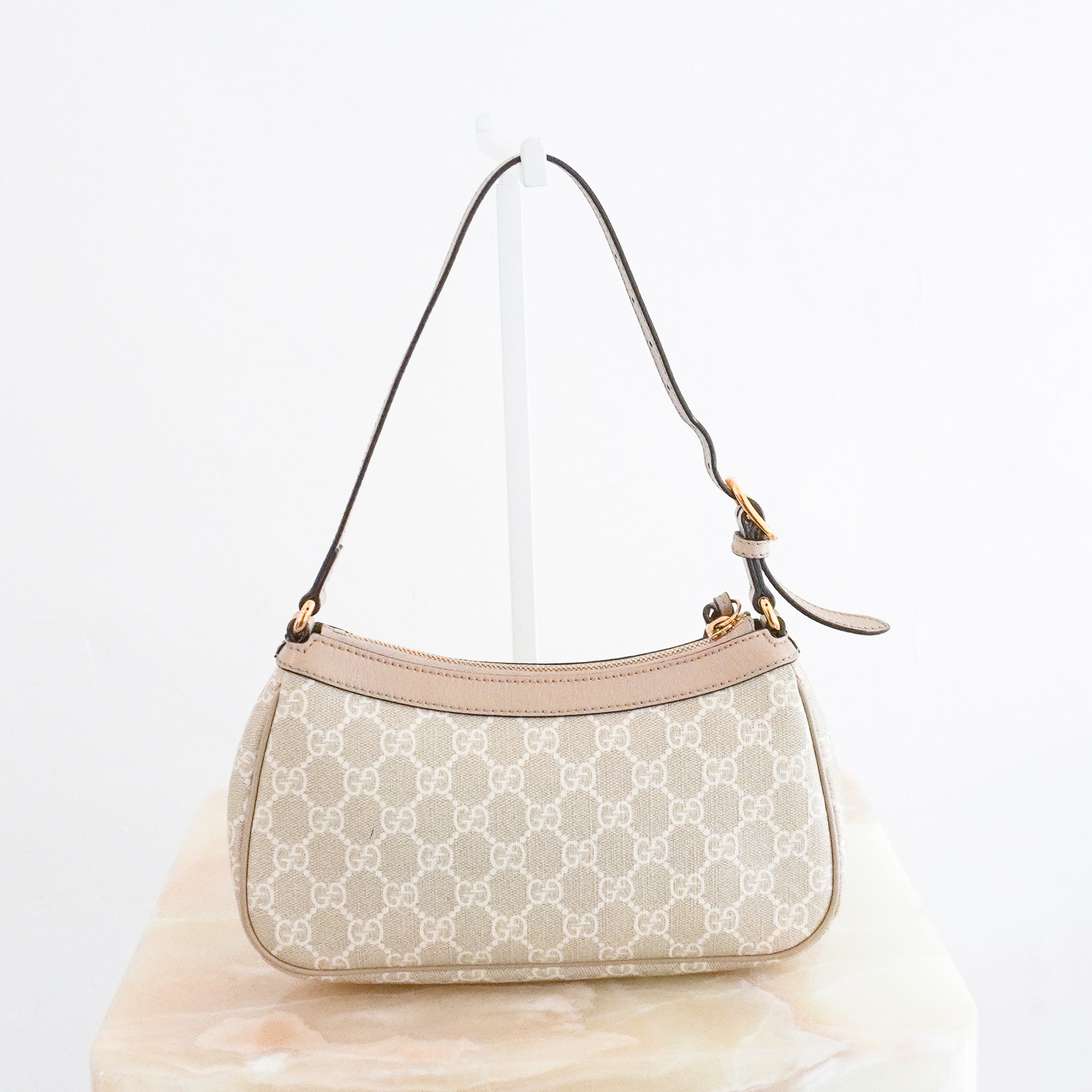 Authentic Gucci Ophidia Small Shoulder Bag in beige and ivory GG Supreme canvas with beige leather trim, gold-tone Double G logo hardware, adjustable shoulder strap and zip-top closure.