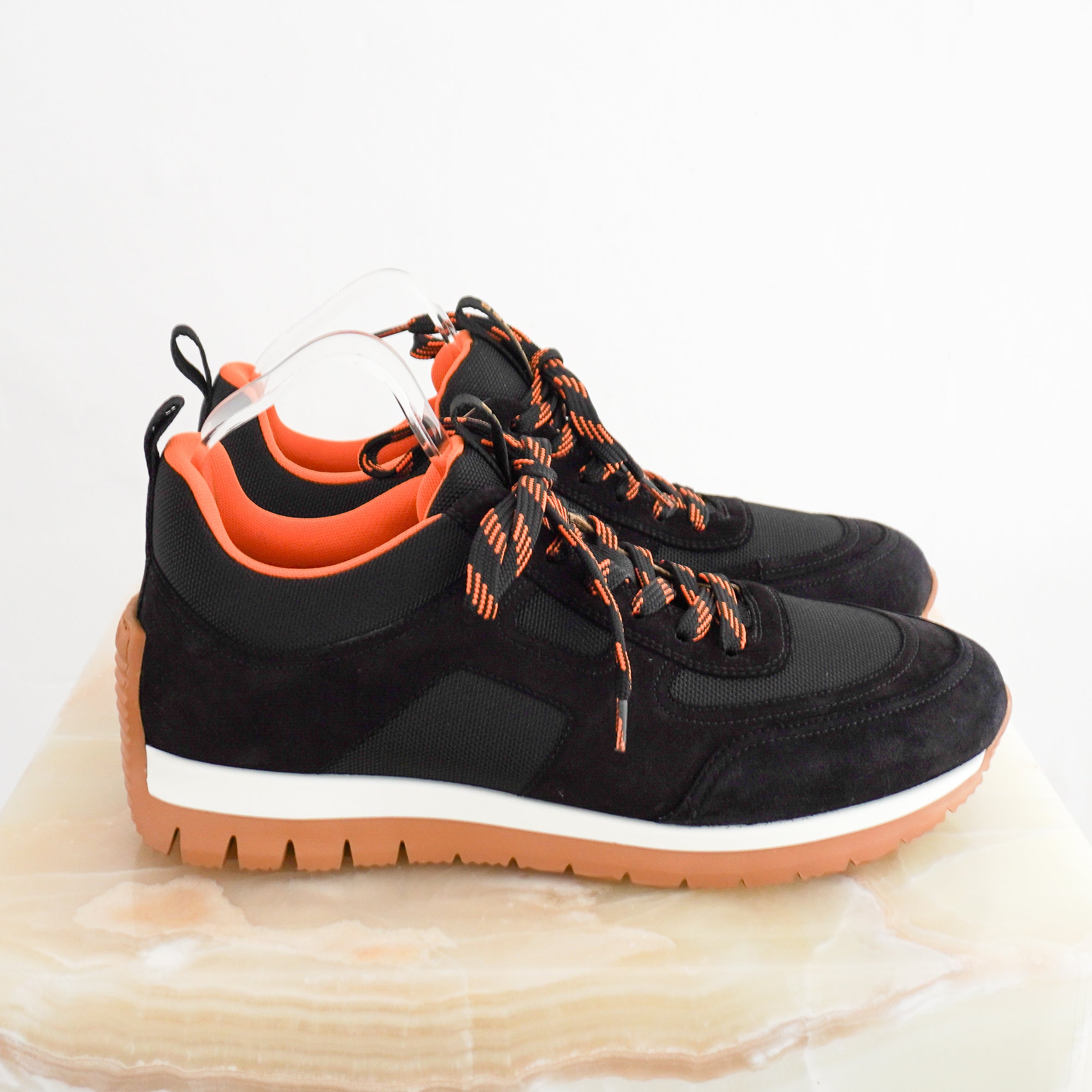 Hermès Jimmy Sneakers in Noir Black side photo chelsea london