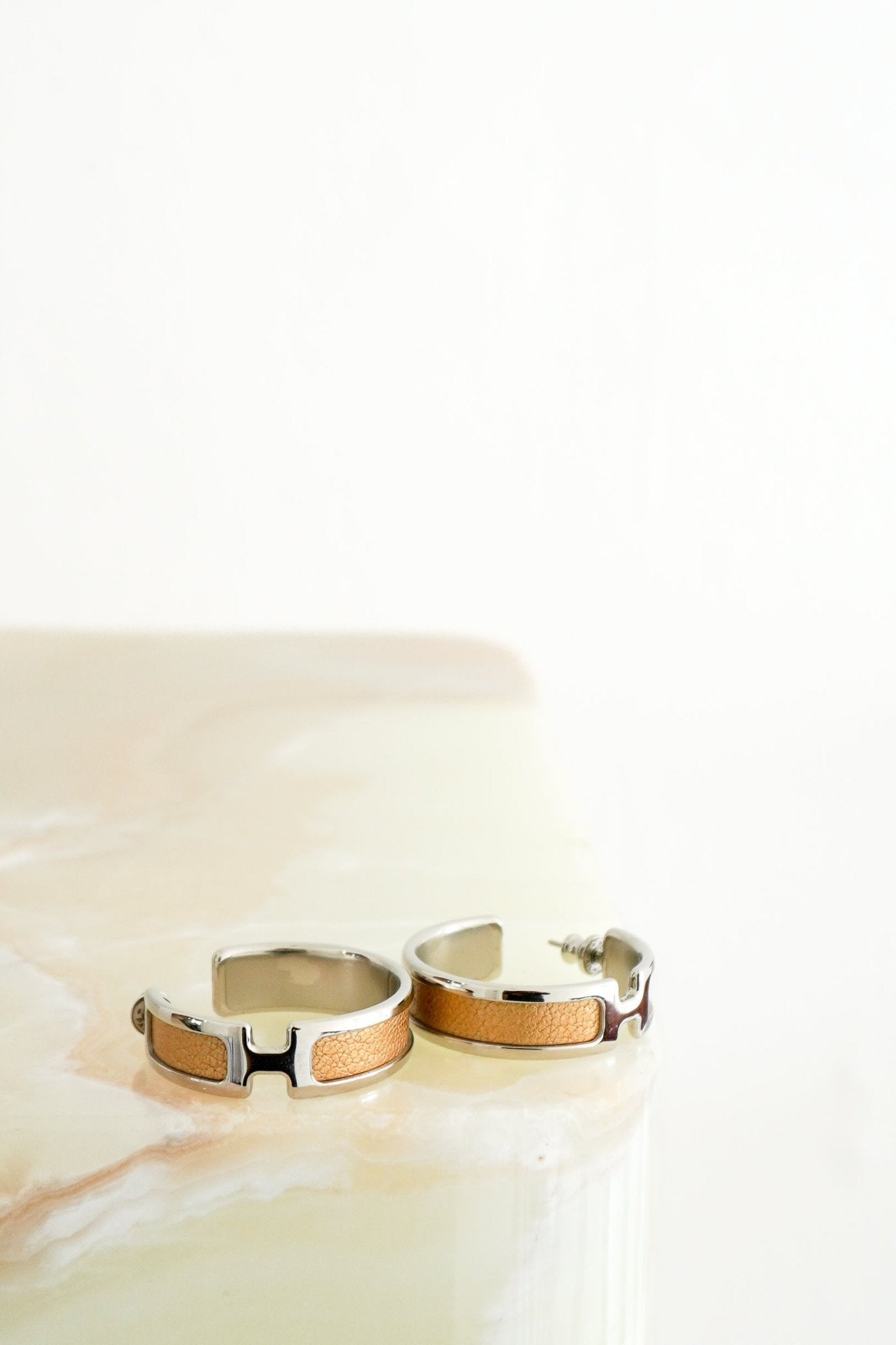 Hermès Olympe Earrings in Palladium-Plated Metal & Doré Metallic Leather (RRP £660) | Authentic Preloved FINAL SALE - Reloved Again
