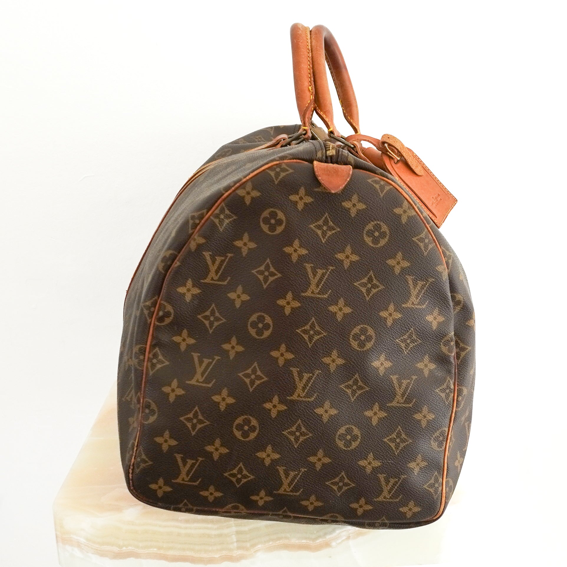 Louis Vuitton Keepall Bandoulière 55 in Brown Monogram Canvas with Vachetta Leather side photo chelsea london