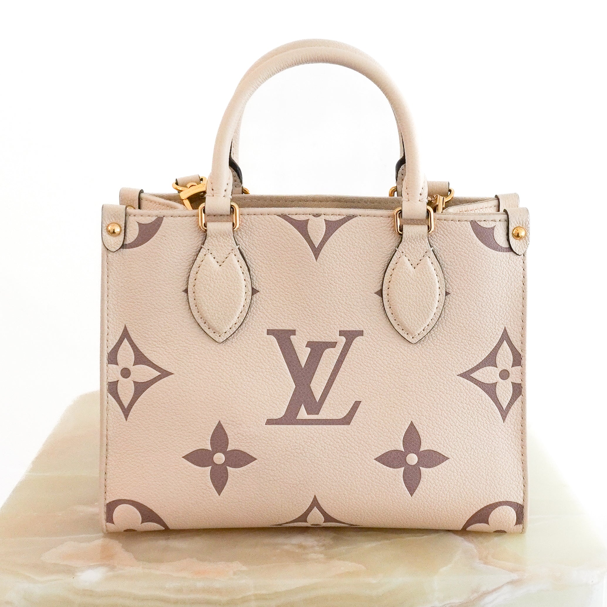 Louis Vuitton OnTheGo PM Bag in White Monogram Empreinte Leather back photo chelsea london