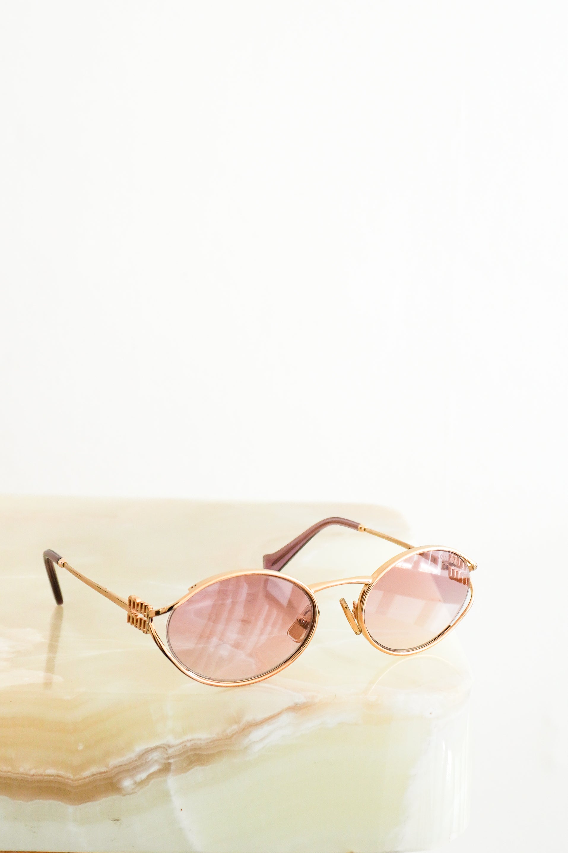 Miu Miu Logo Oval Pink & Gold Metal Sunglasses SMU52Y front photo chelsea london