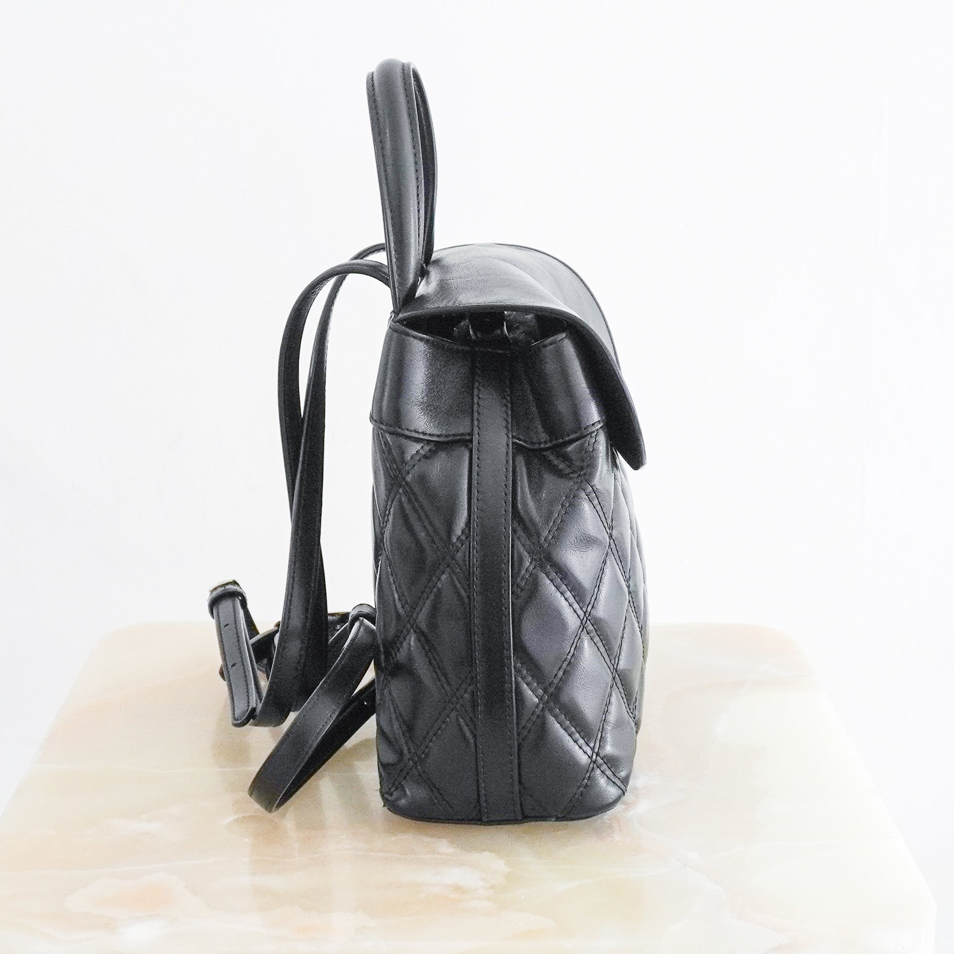 Mulberry Black Quilted Mini Backpack crafted in England from beautifully soft black leather with an all-over quilted finish and postman's lock.