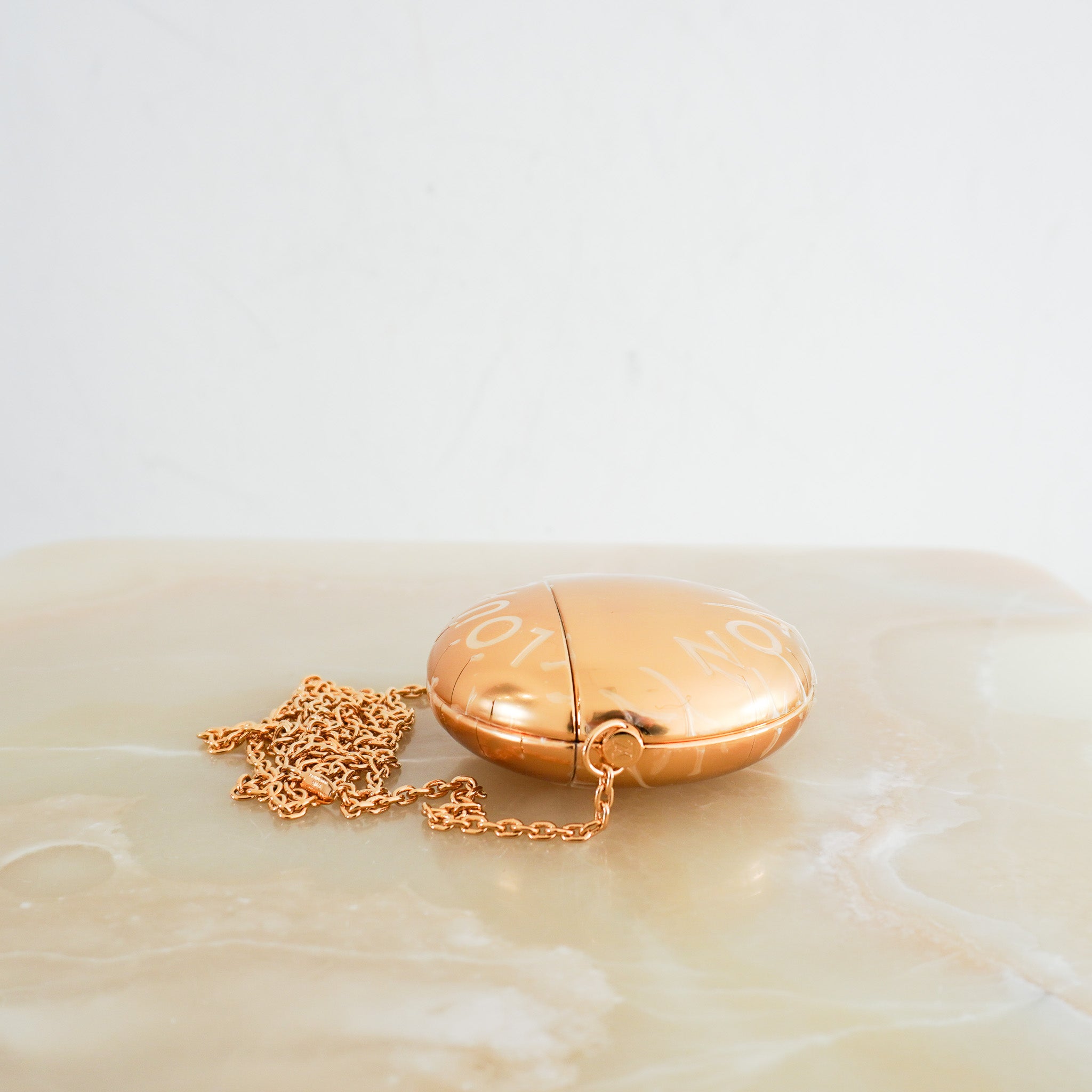 NEW-Louis-Vuitton-Gold-XL-Stud-Airpods-Case-side-picture