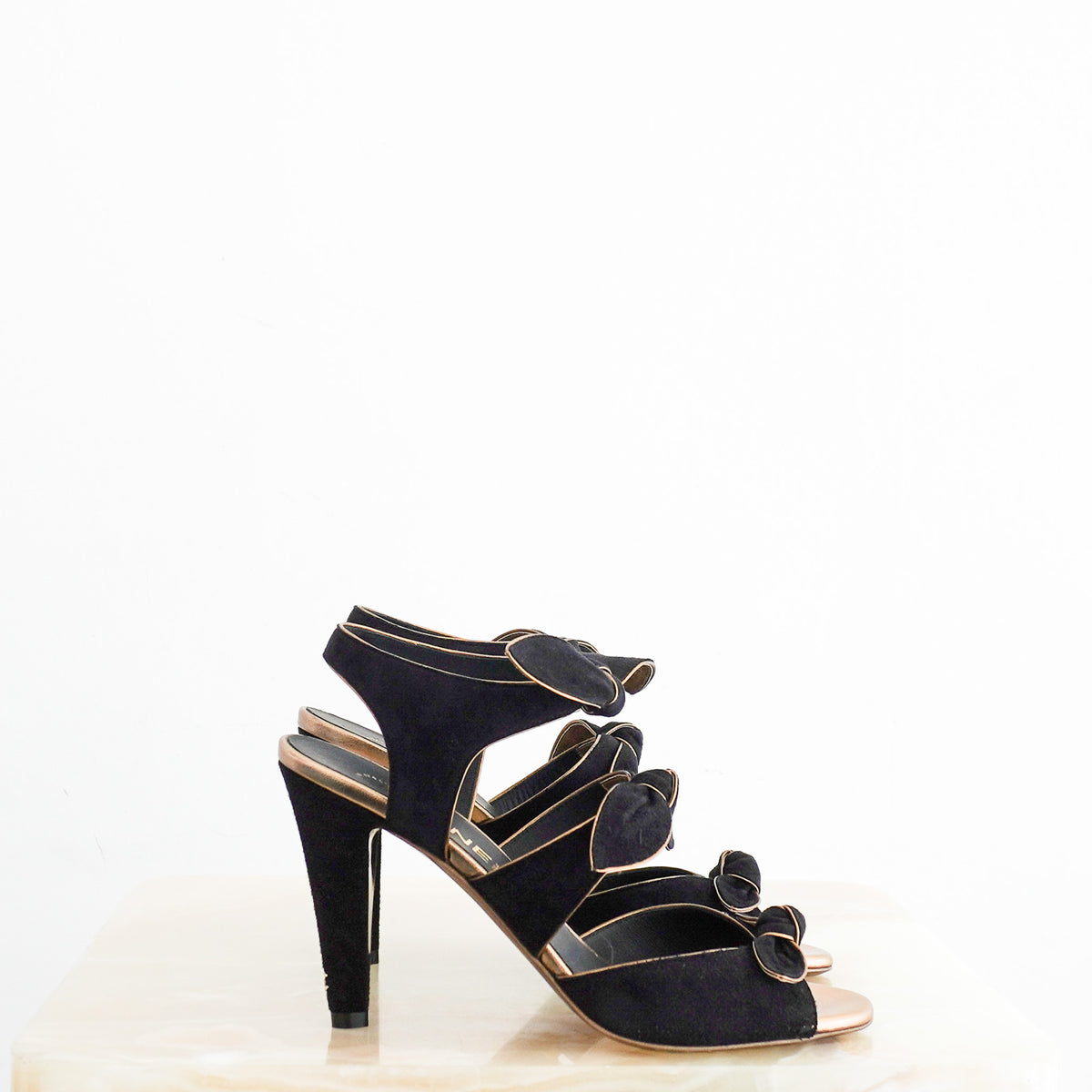 Side: Chanel Black and Gold Bow Heels