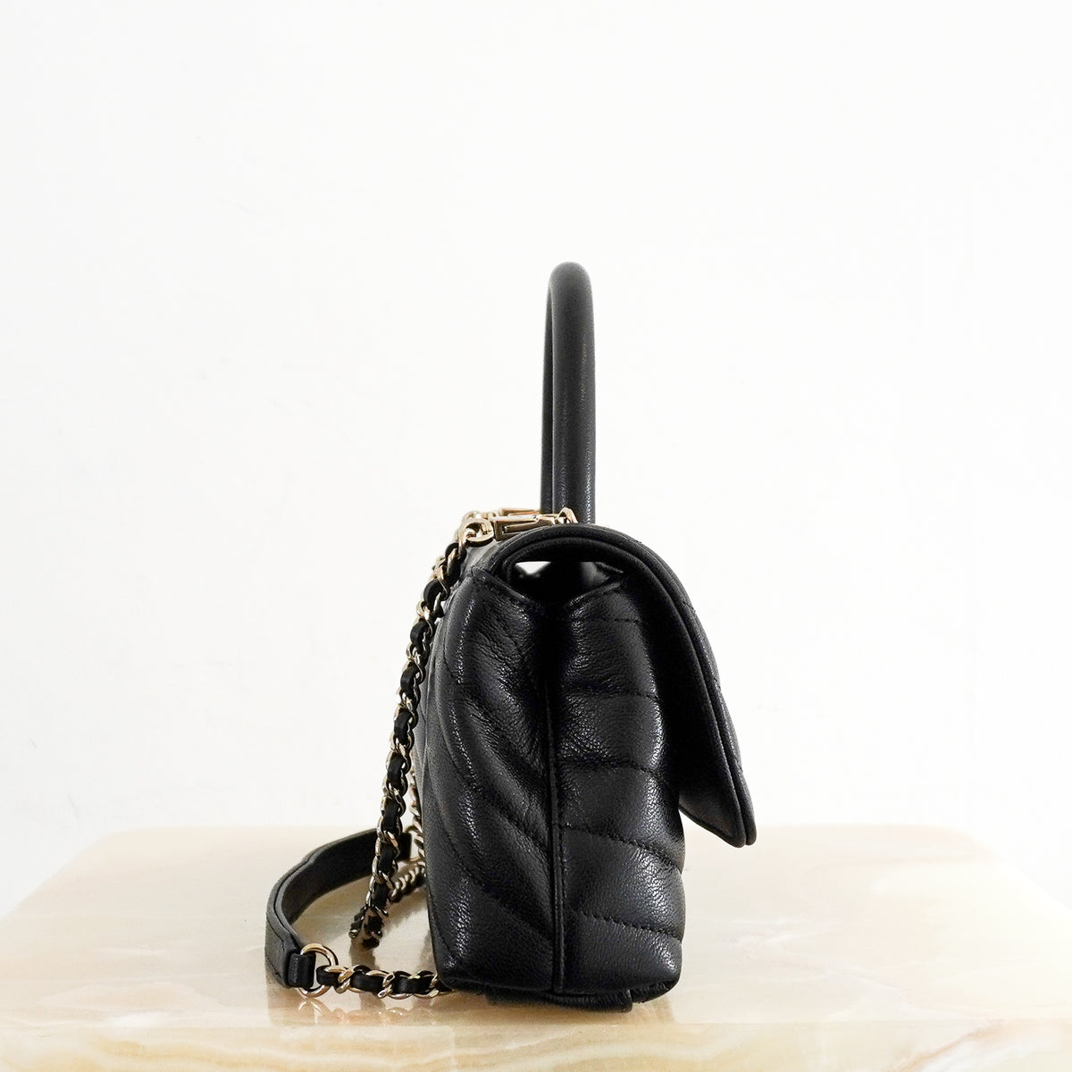 Side: Chanel Coco Top Handle Black Chevron Quilted Leather Bag