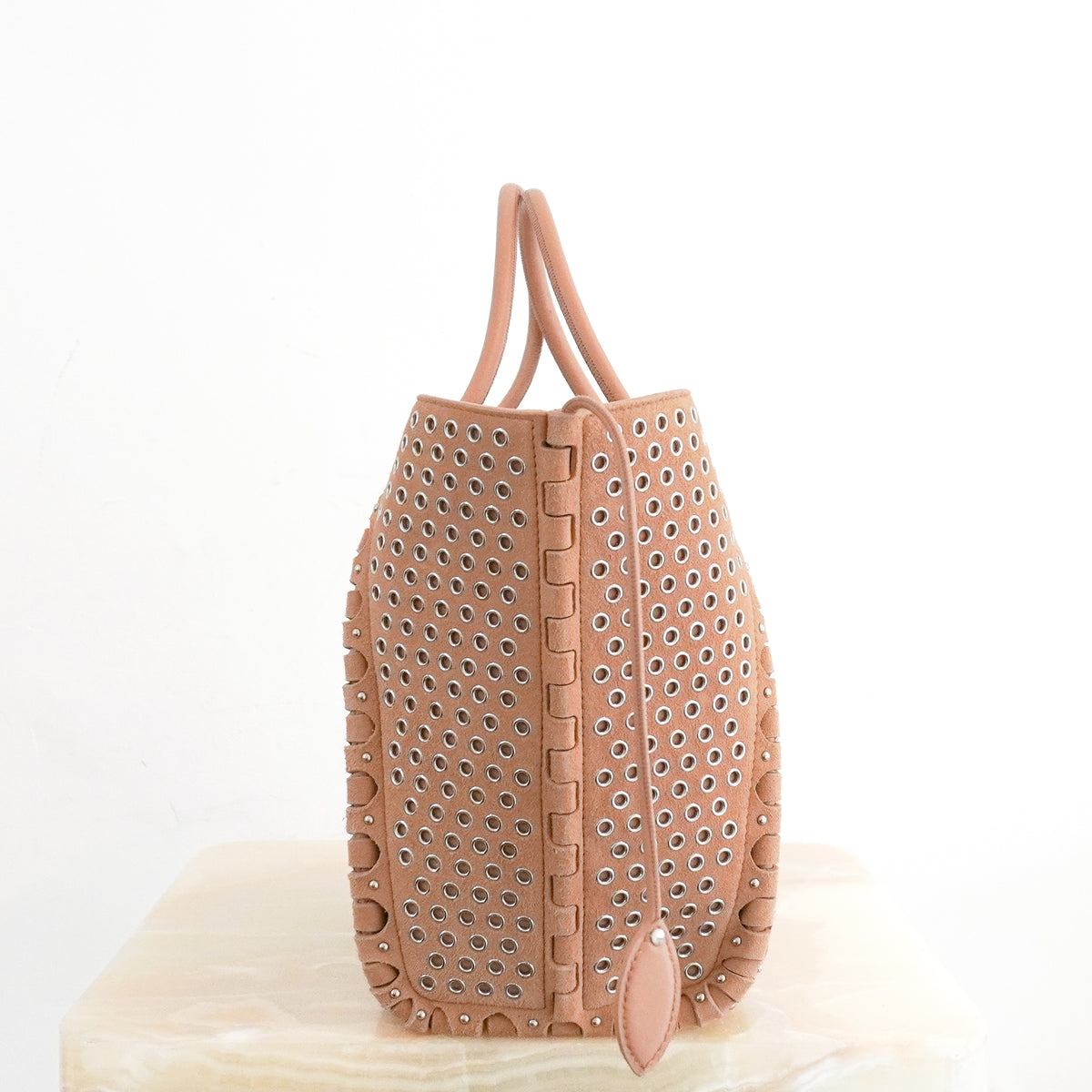Side Image: Alaïa Le Hinge Small Eyelet Tote Bag in Tan Suede