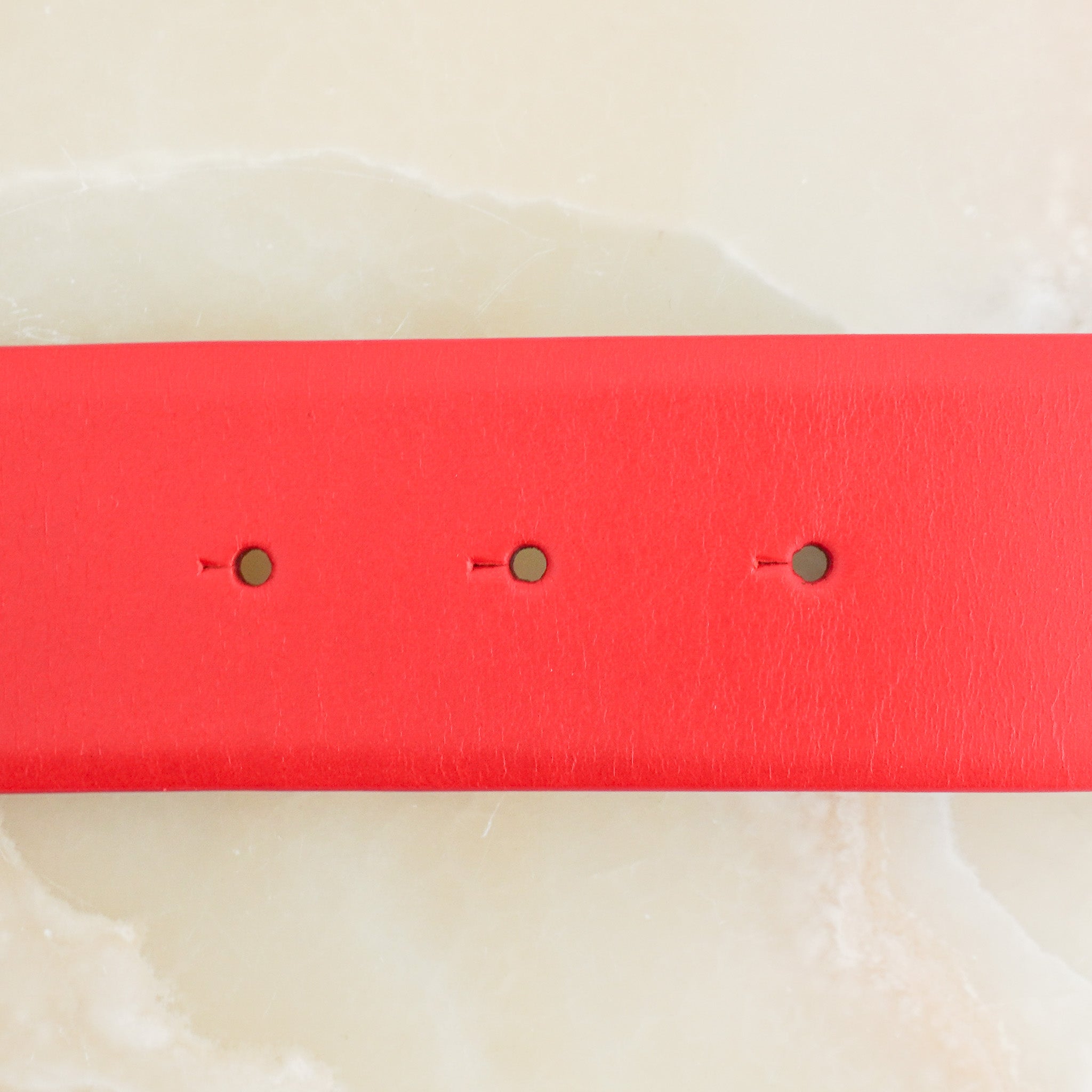 Side image of the Chanel Logo Letter Belt in Red Calfskin Leather