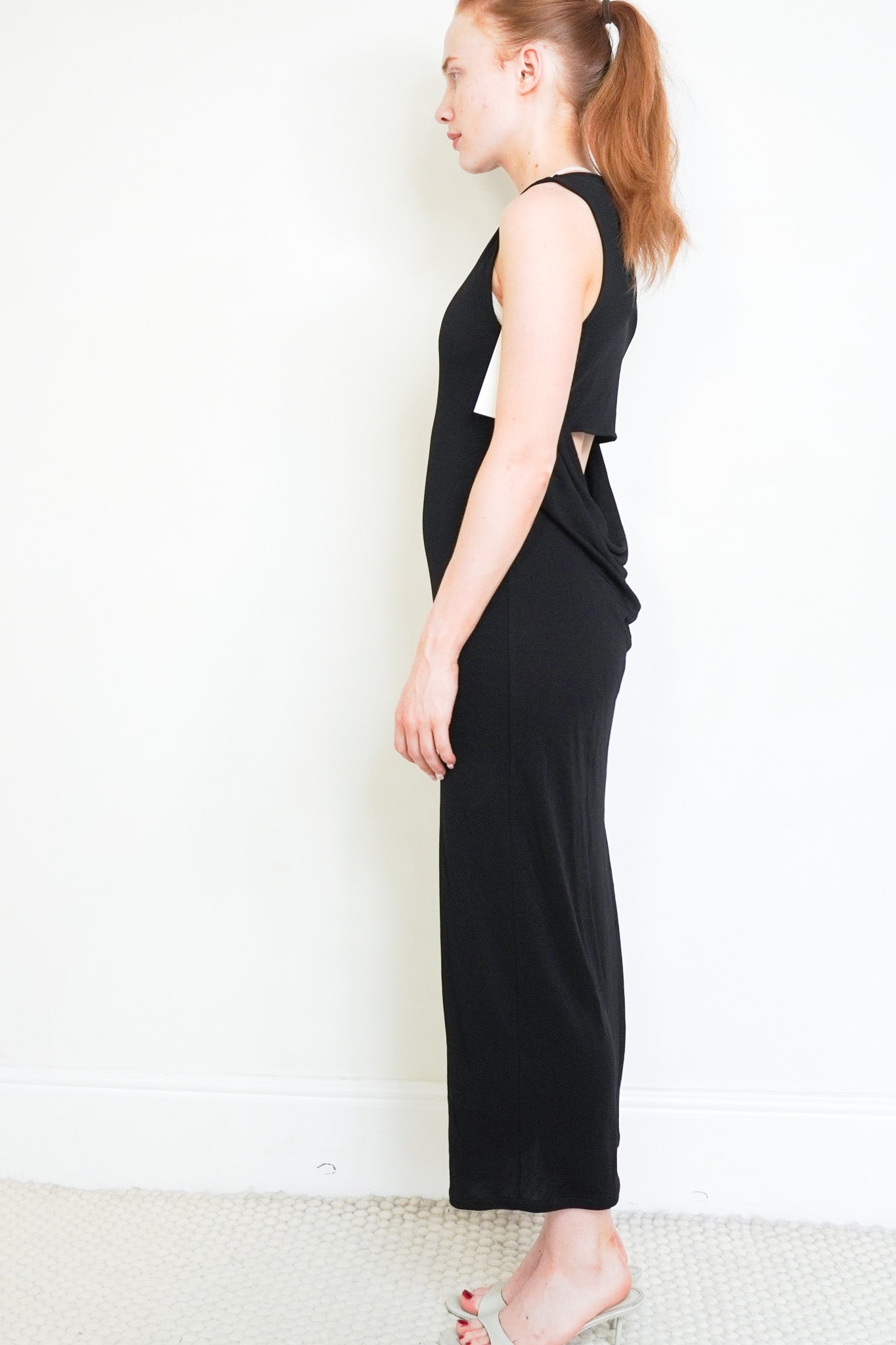Side image of the Frame Black Open Back Midi Dress