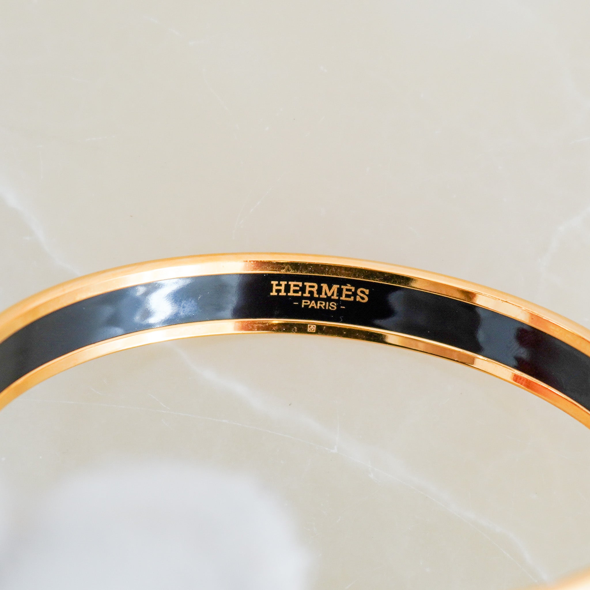 Side image of the Hermes Pink Enamel Bracelet in Gold Plated Metal