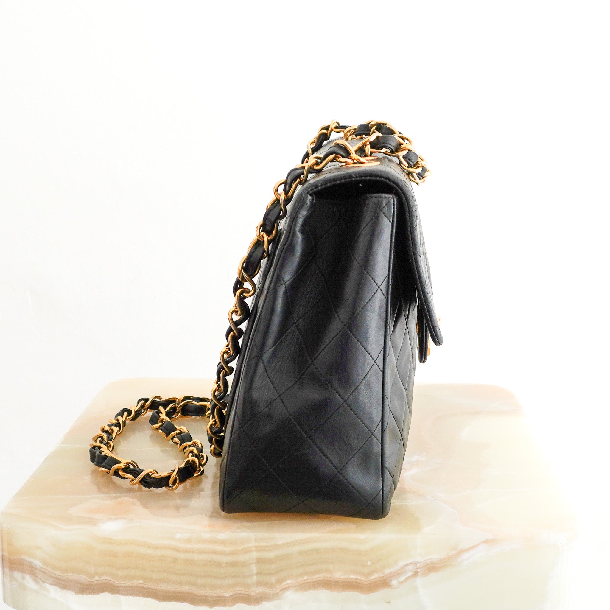 Side photo of the Chanel Vintage Maxi Shoulder Bag in Black