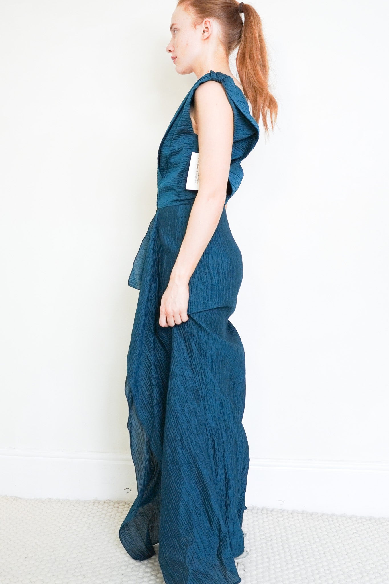 Side photo of the Roland Mouret Teal Silk Gown