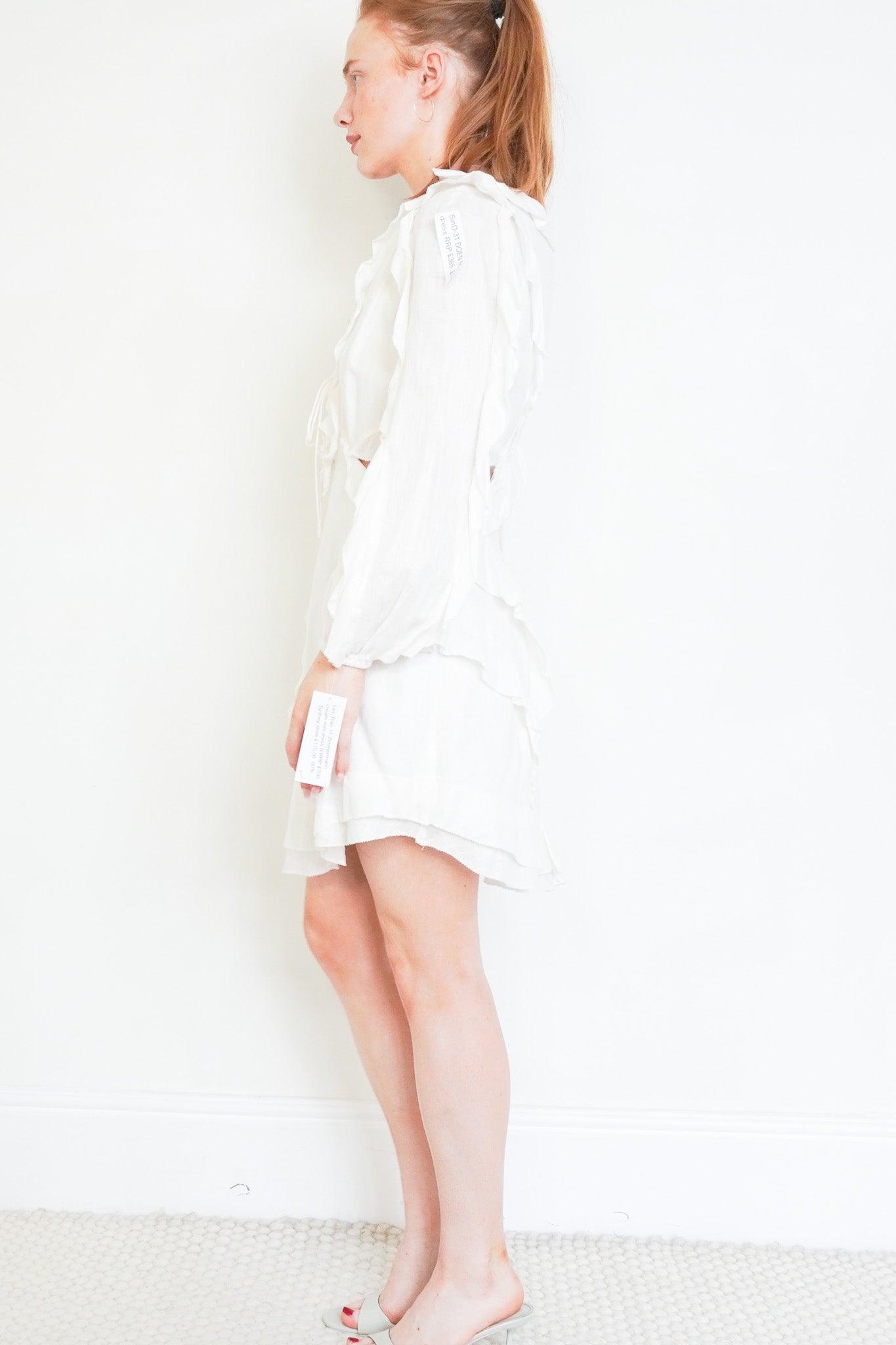 Side photo of the Zimmermann Cream Mini Dress