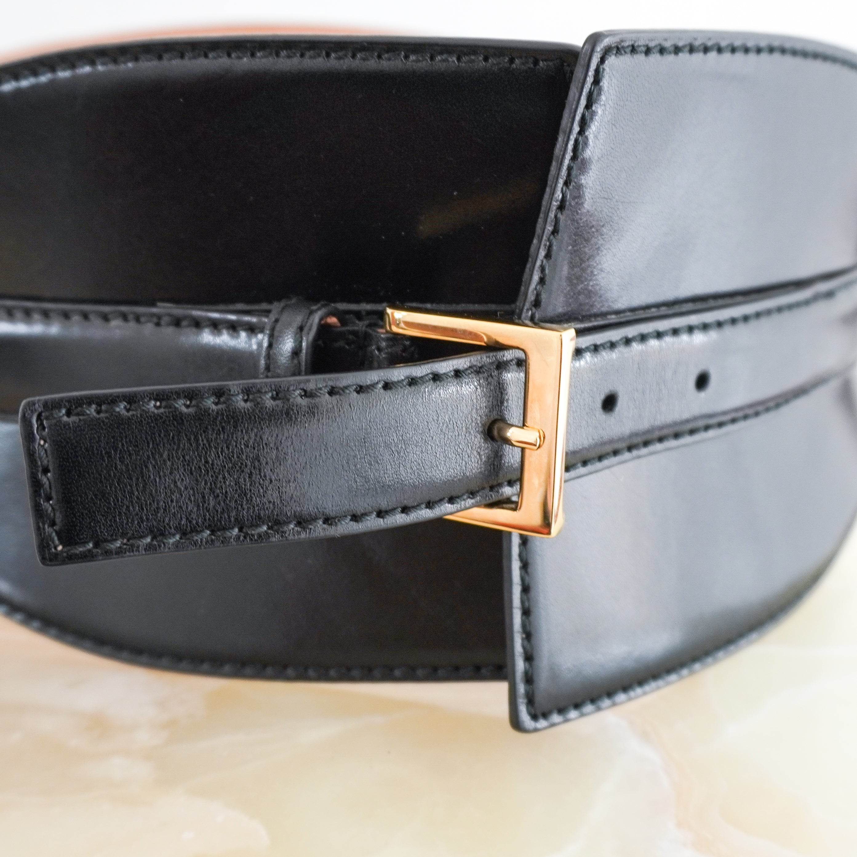 close up image of the Alexander Mcqueen Corset belt showing buckle