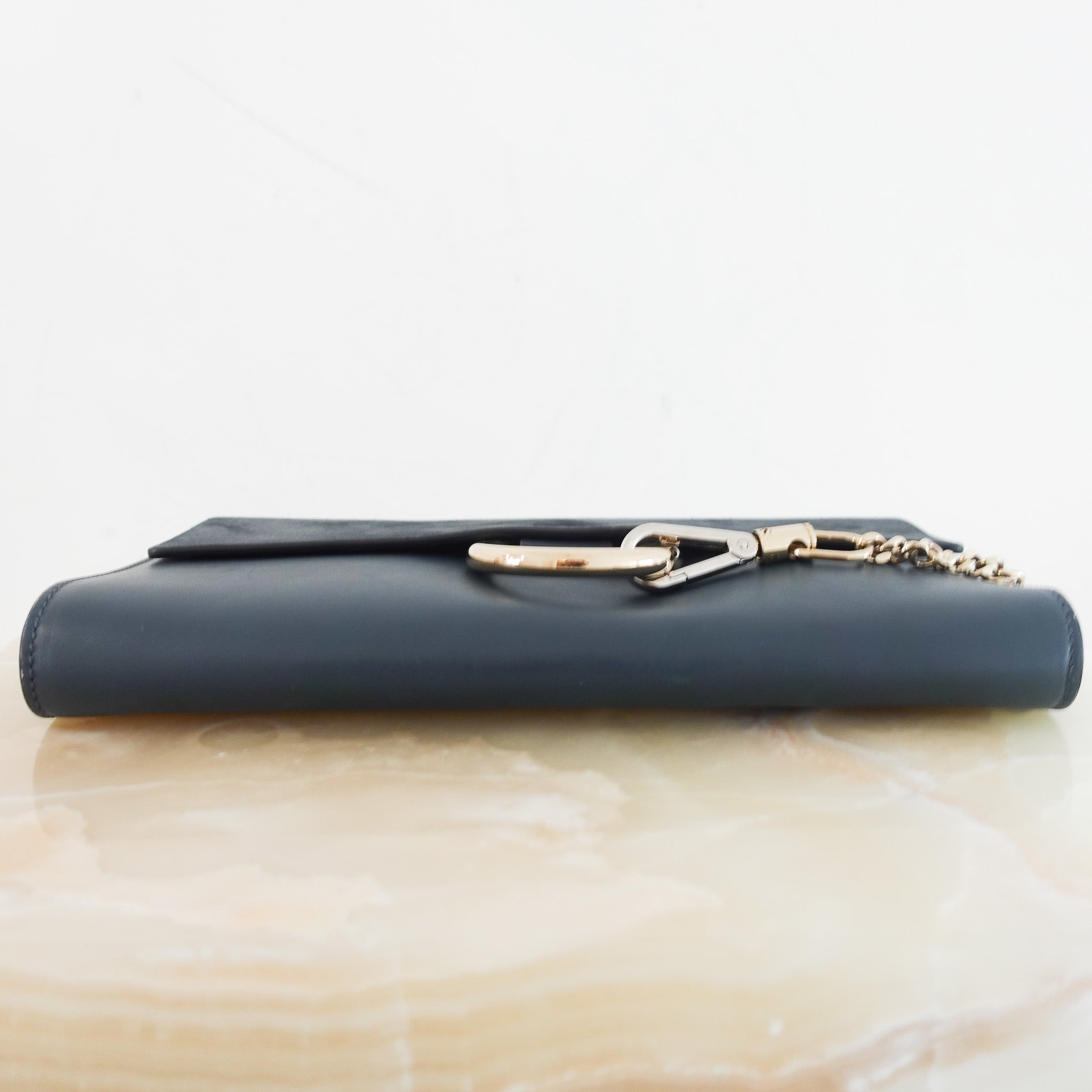 chloe-faye-suede-clutch-in-blue-depth-picture-chelsea-london