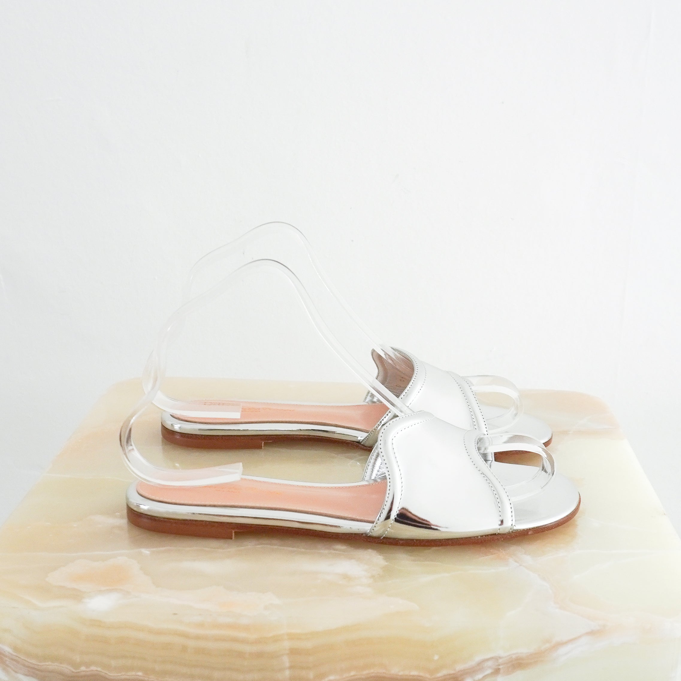 Side image of the Gianvito Rossi mules, showing the asymmetric strap.