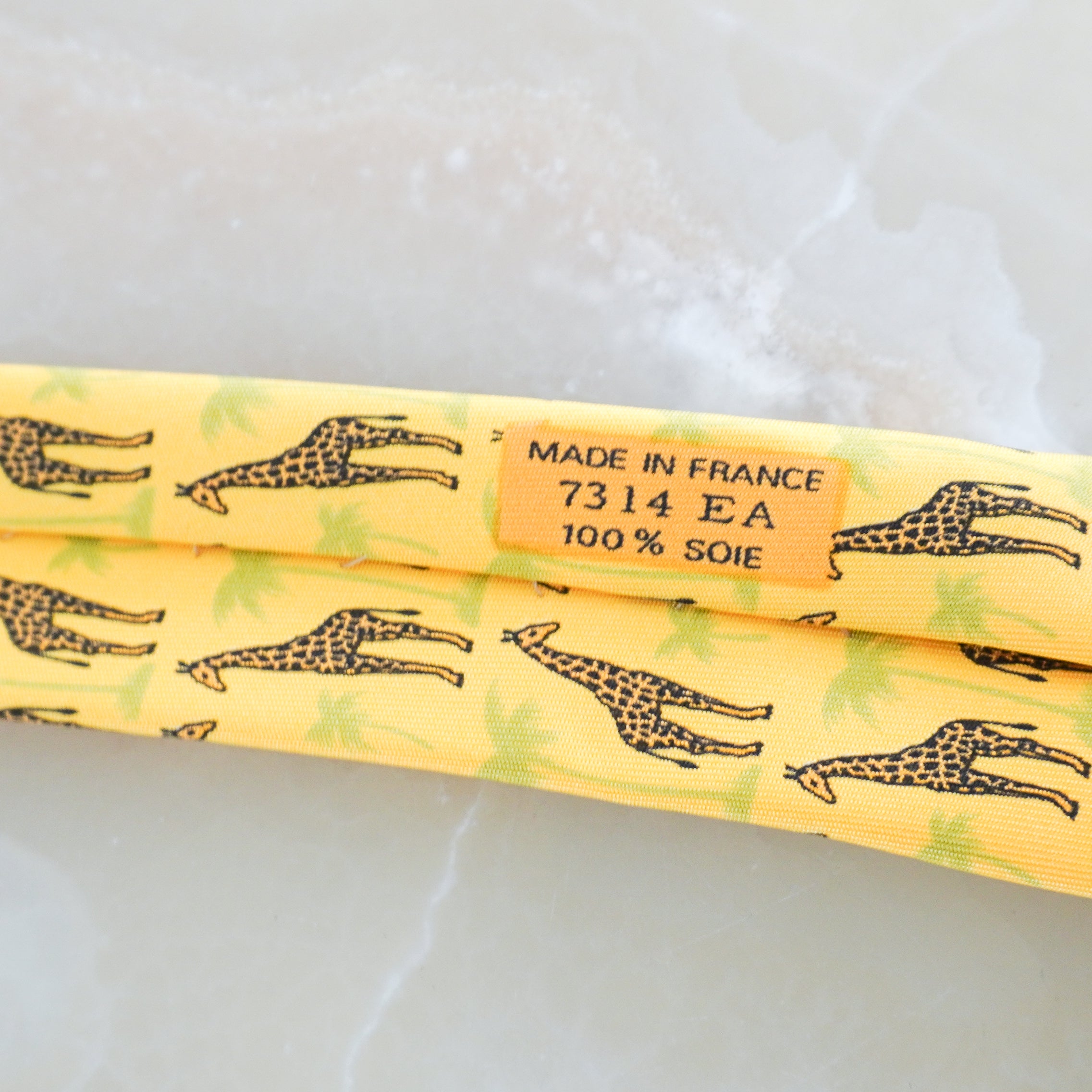 Serial Code picture of the Hermes giraffe tie showing the print