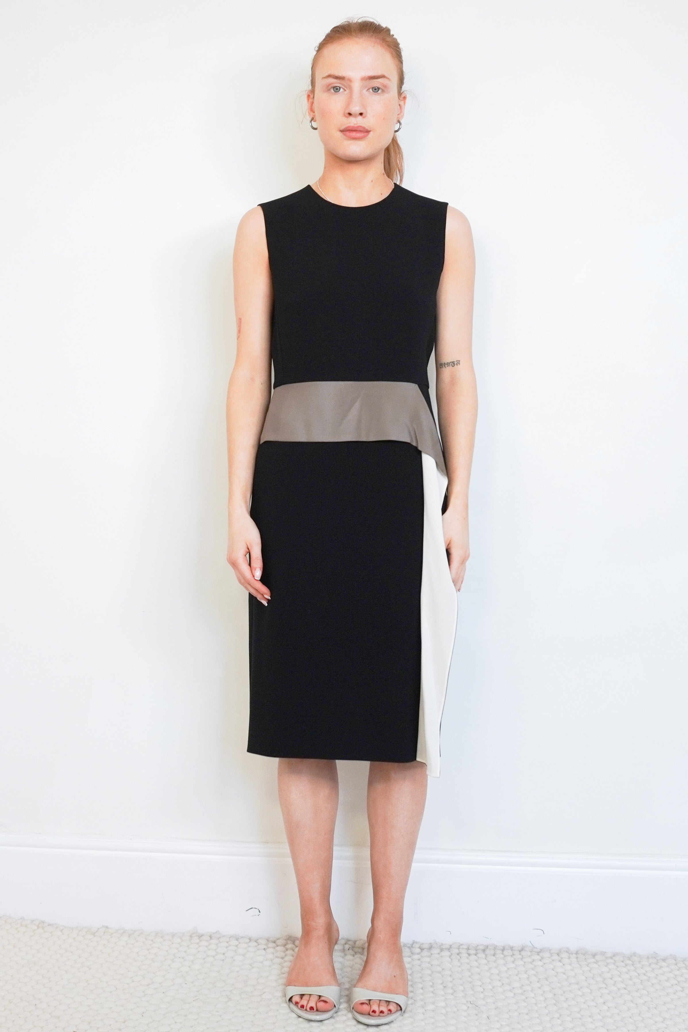 Front picture of th black Maxmara Dress, Showing the neklkine and front detail.