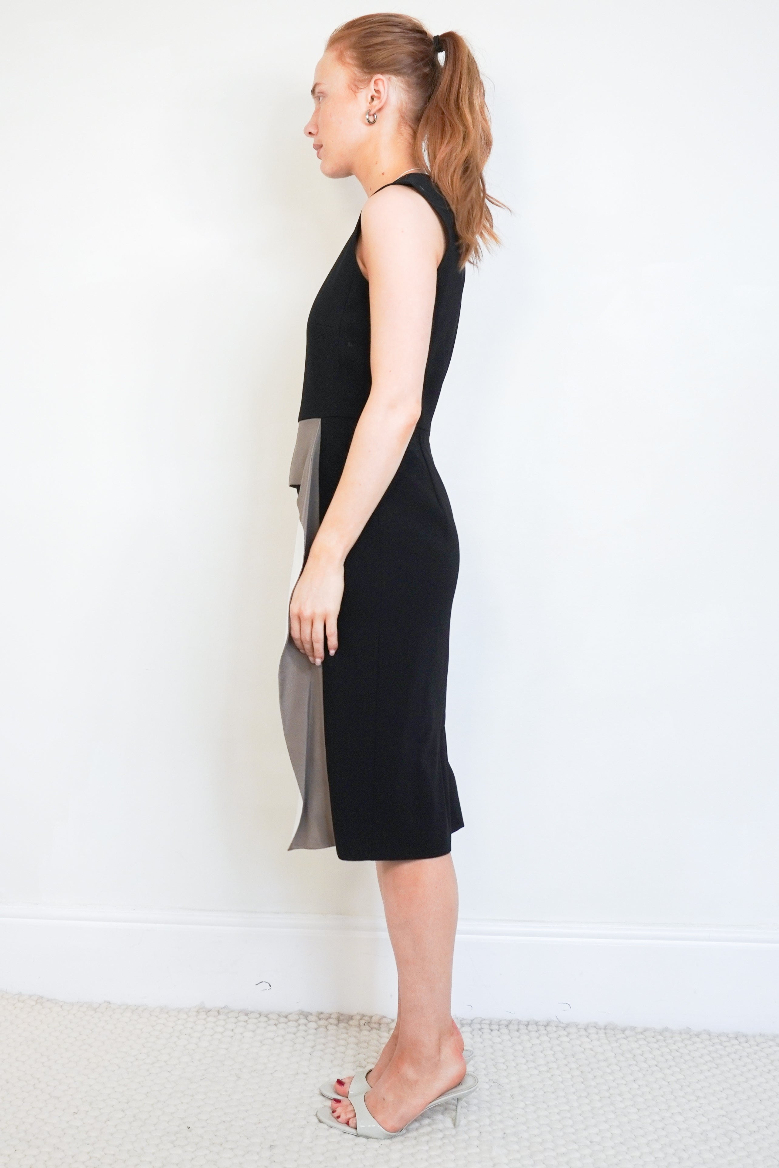 Side picture of th black MaxMara Dress, Showing the sleeves .