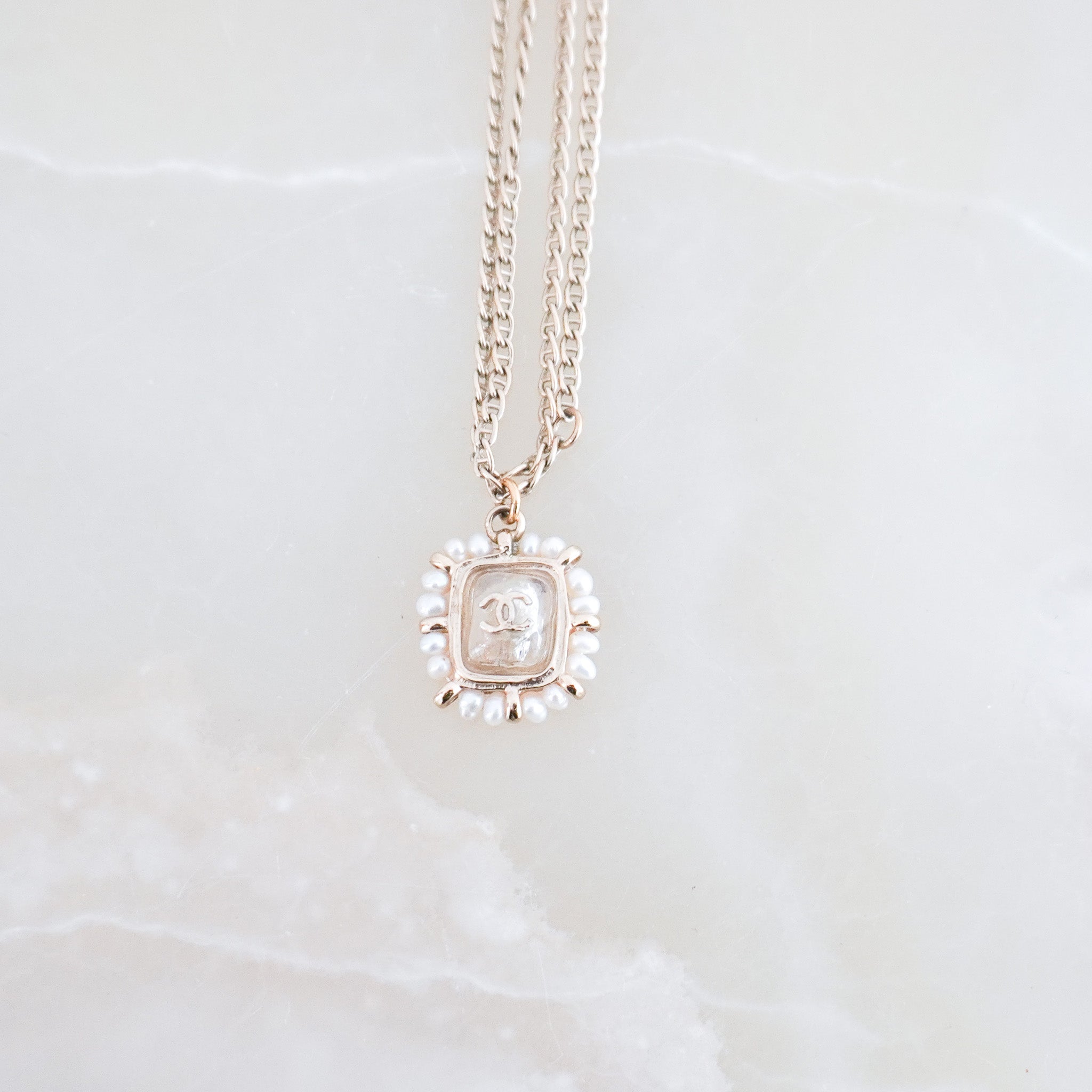 side image of the Chanel Pearl & CC Pendant Necklace