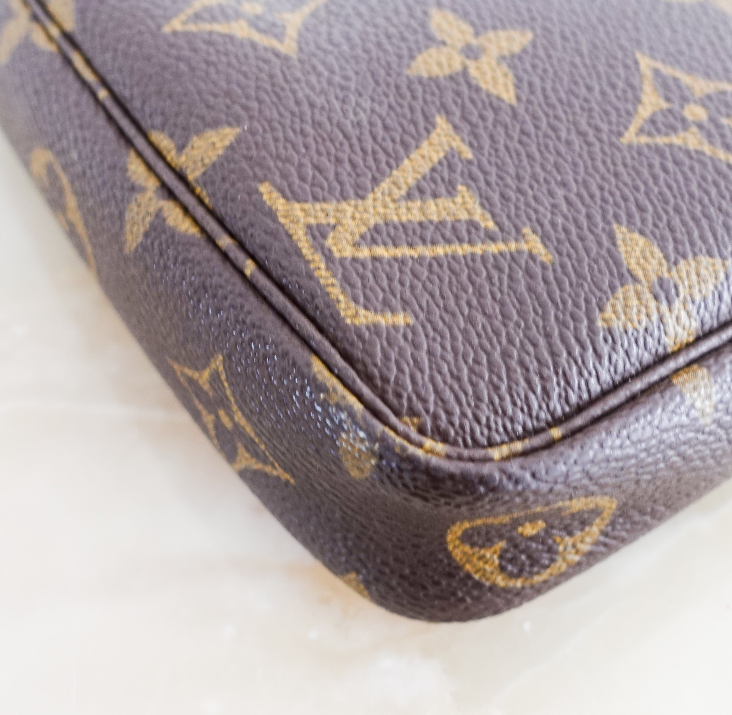 Monogram coated canvas clutch pouchette