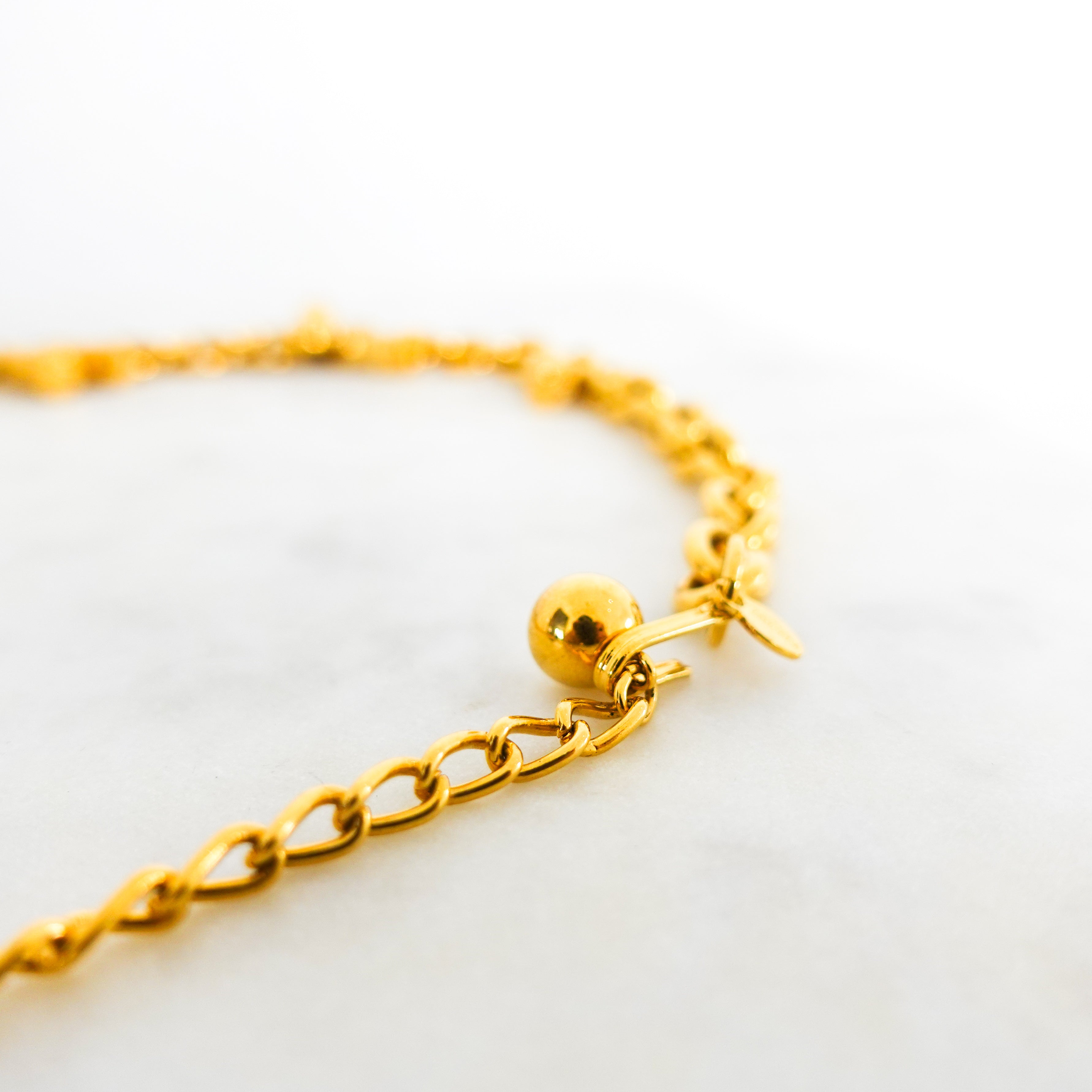 Gold plated necklace with tassles