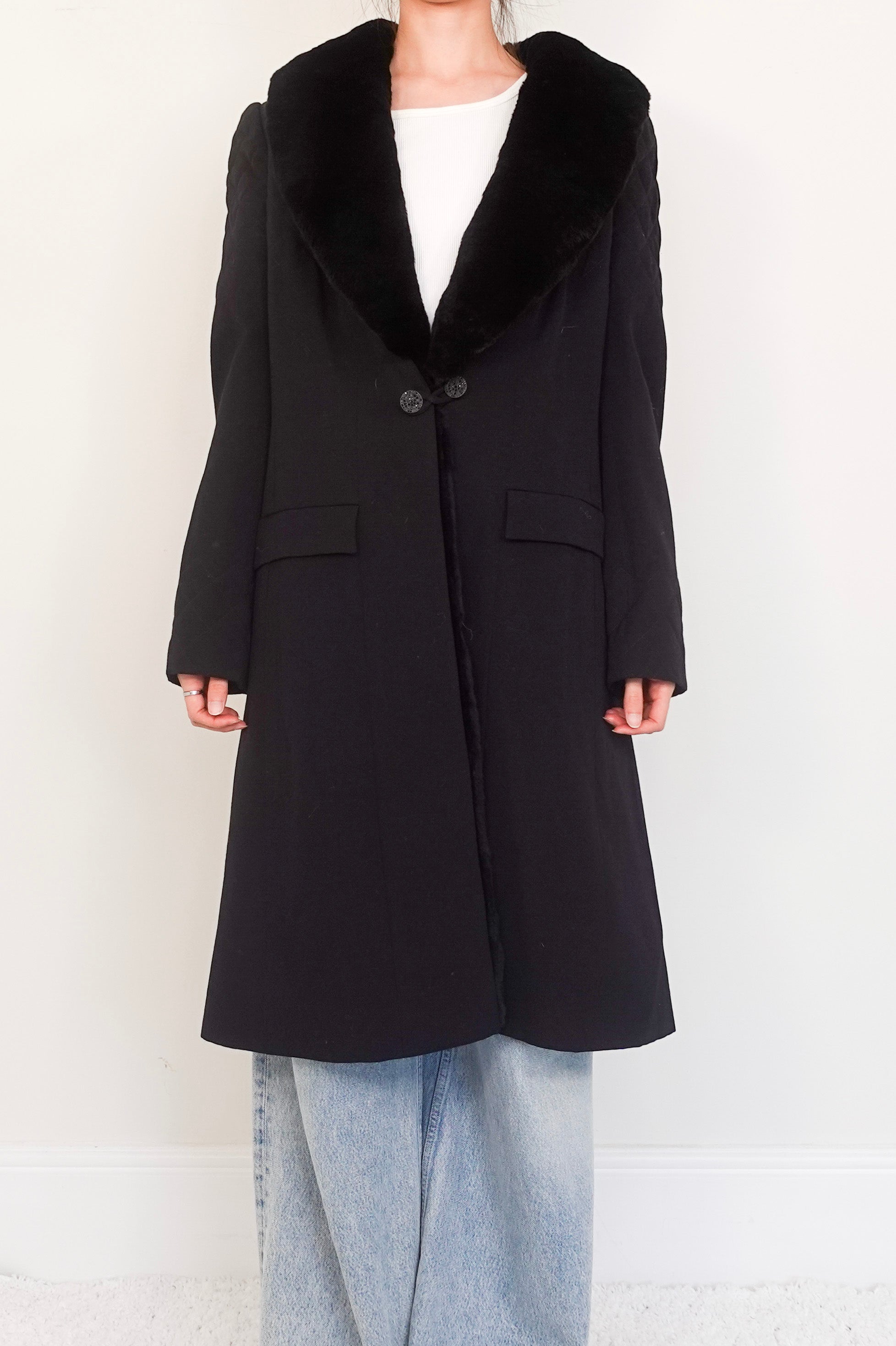 black wool coat with fur appliqué